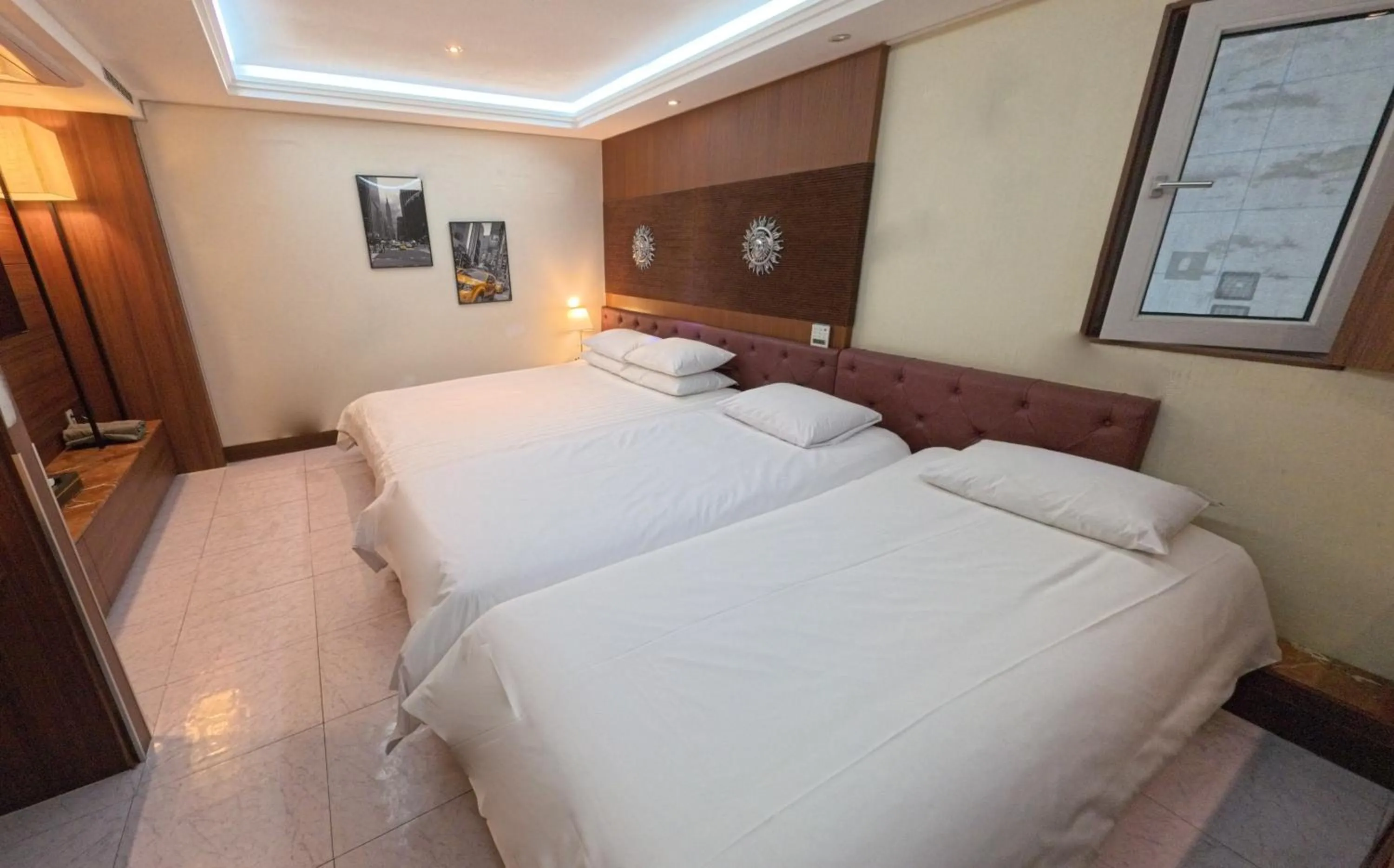 Bed in Friendly DH Naissance Hotel by Mindrum Group