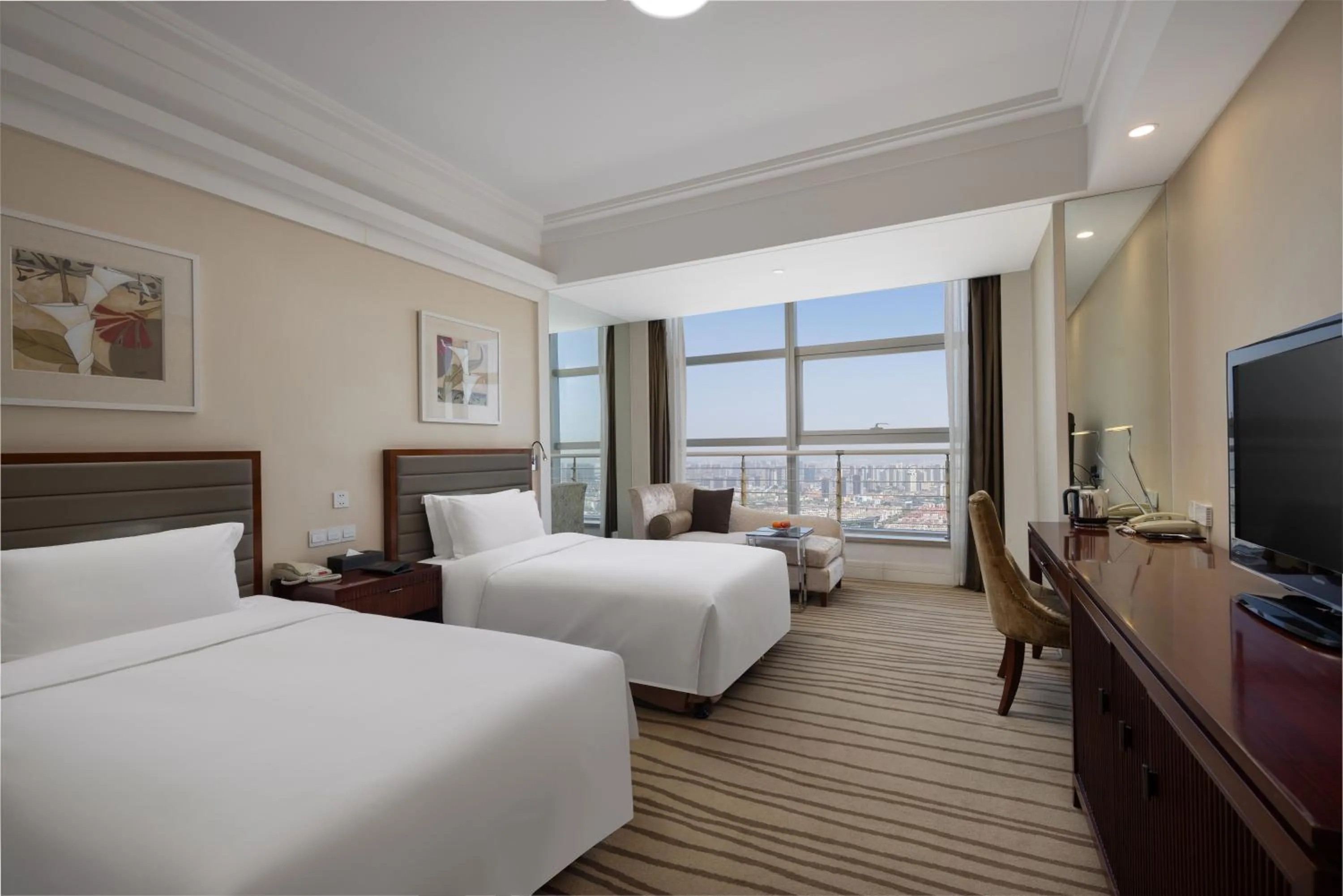 Bed in New Century Hotel Qingdao