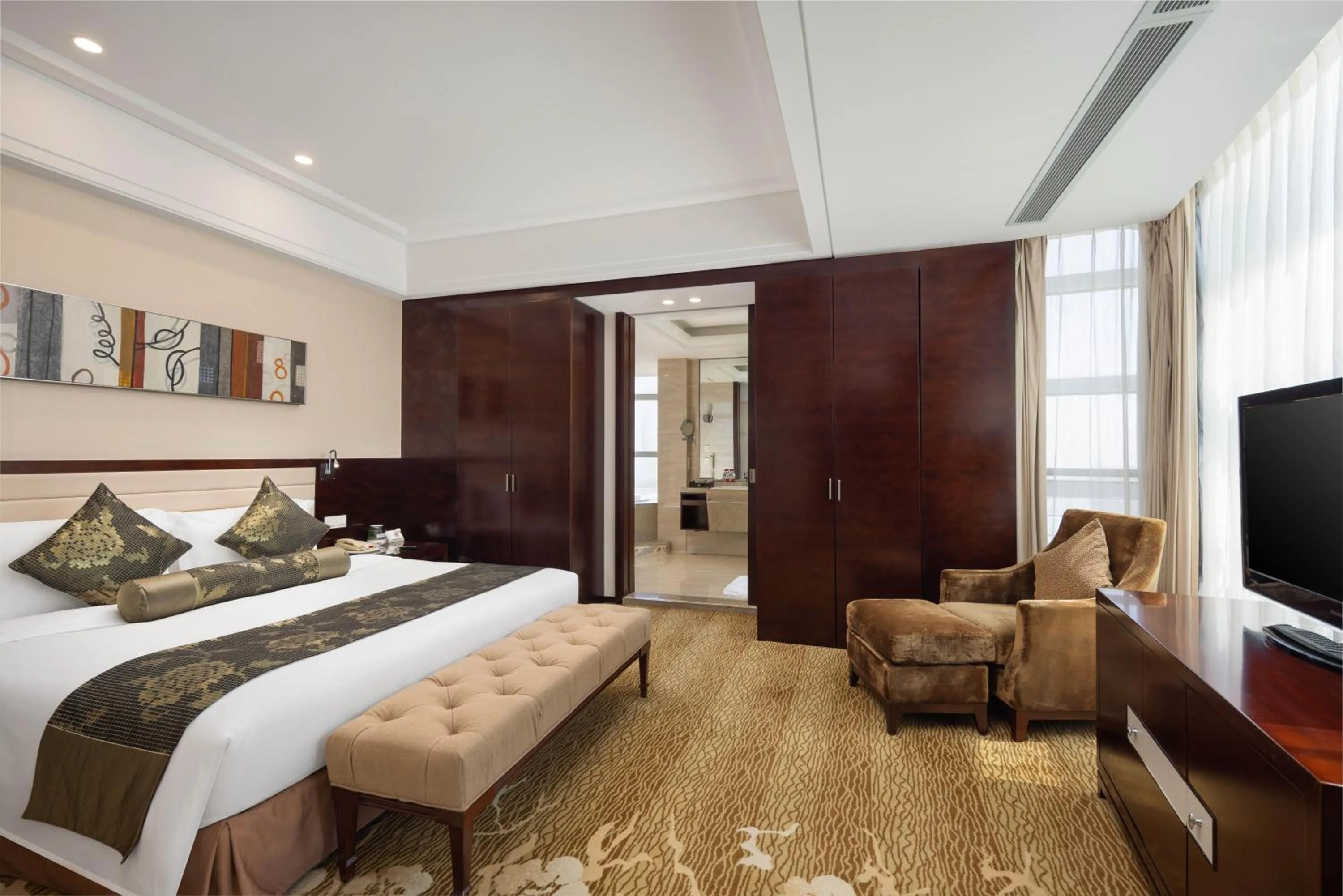 Bed in New Century Hotel Qingdao