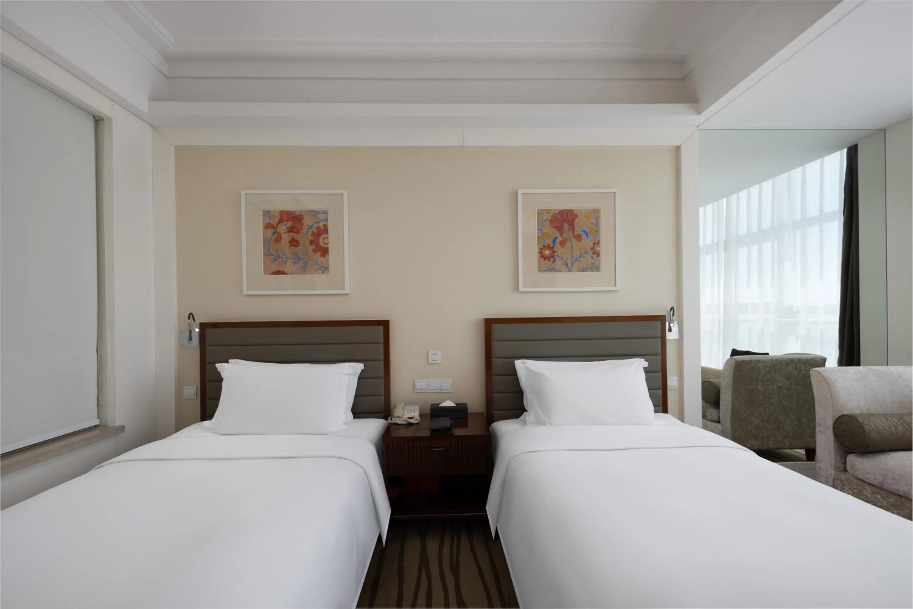 Bed in New Century Hotel Qingdao