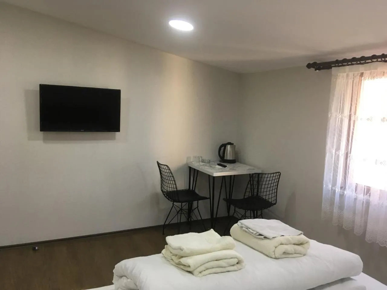 Communal lounge/ TV room, Bed in Kule Pansiyon