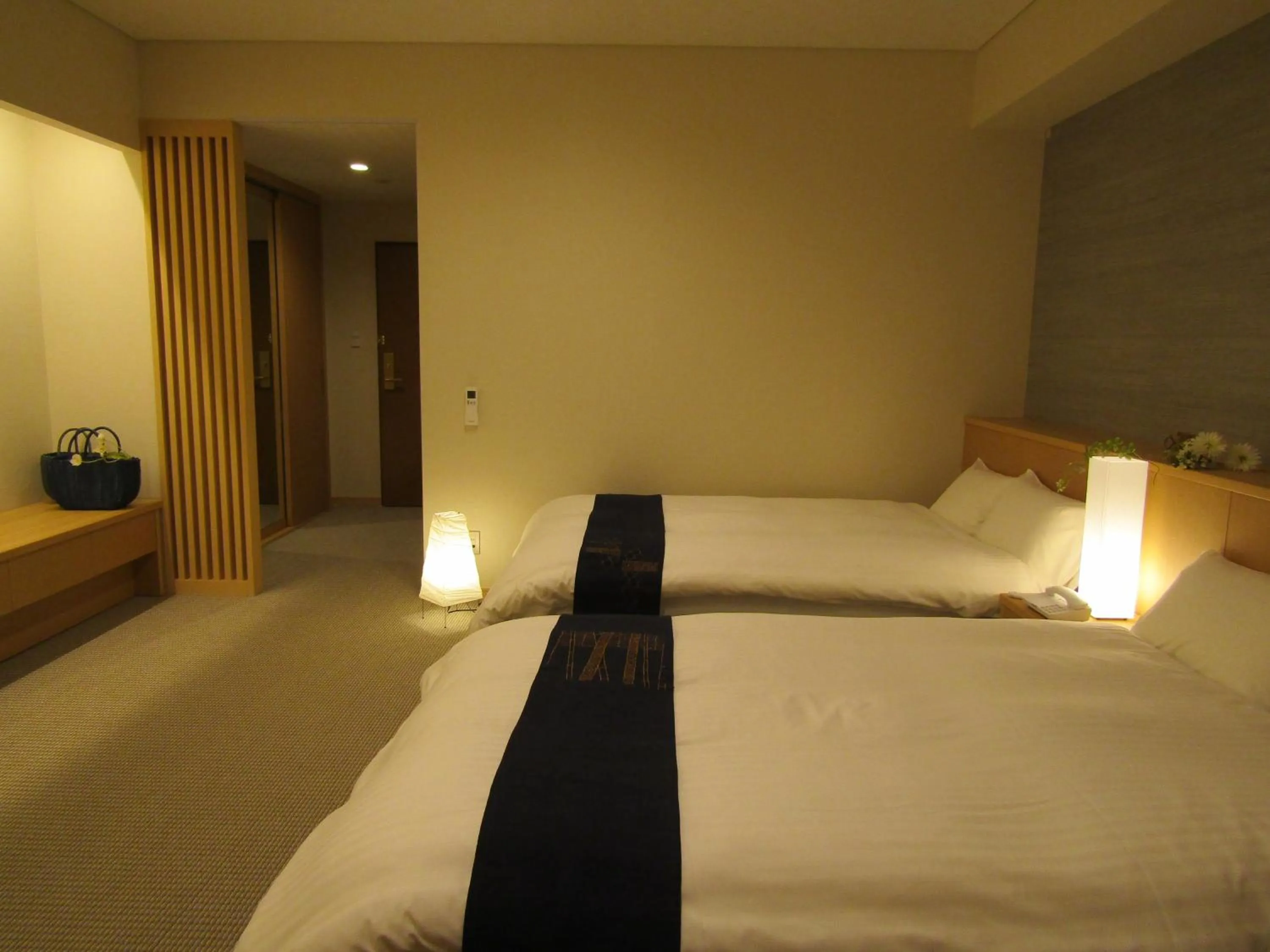 Bed in Japanese Style Hotel Isomura
