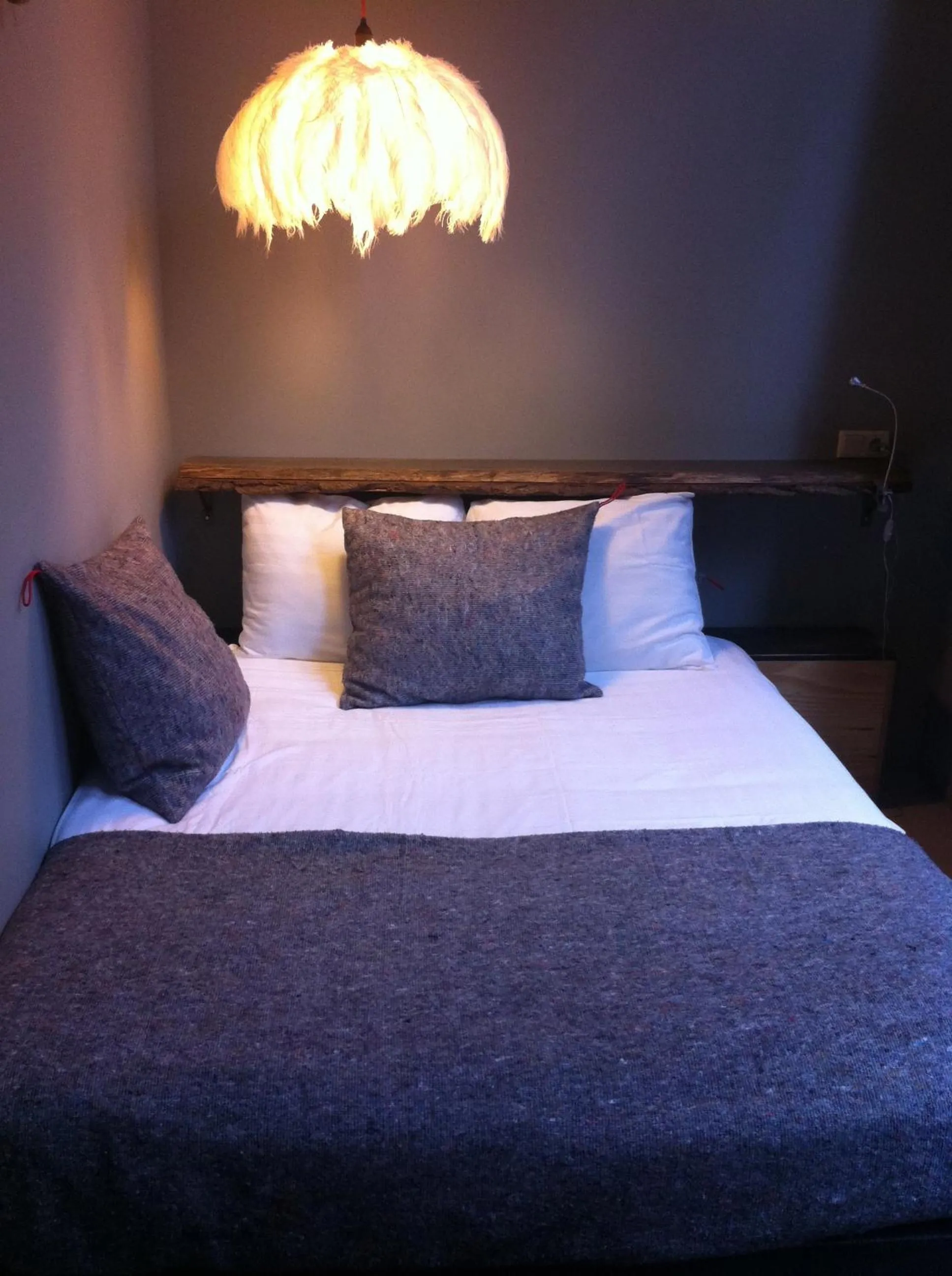 Bed in LABnul50 self check-in hotel Groningen