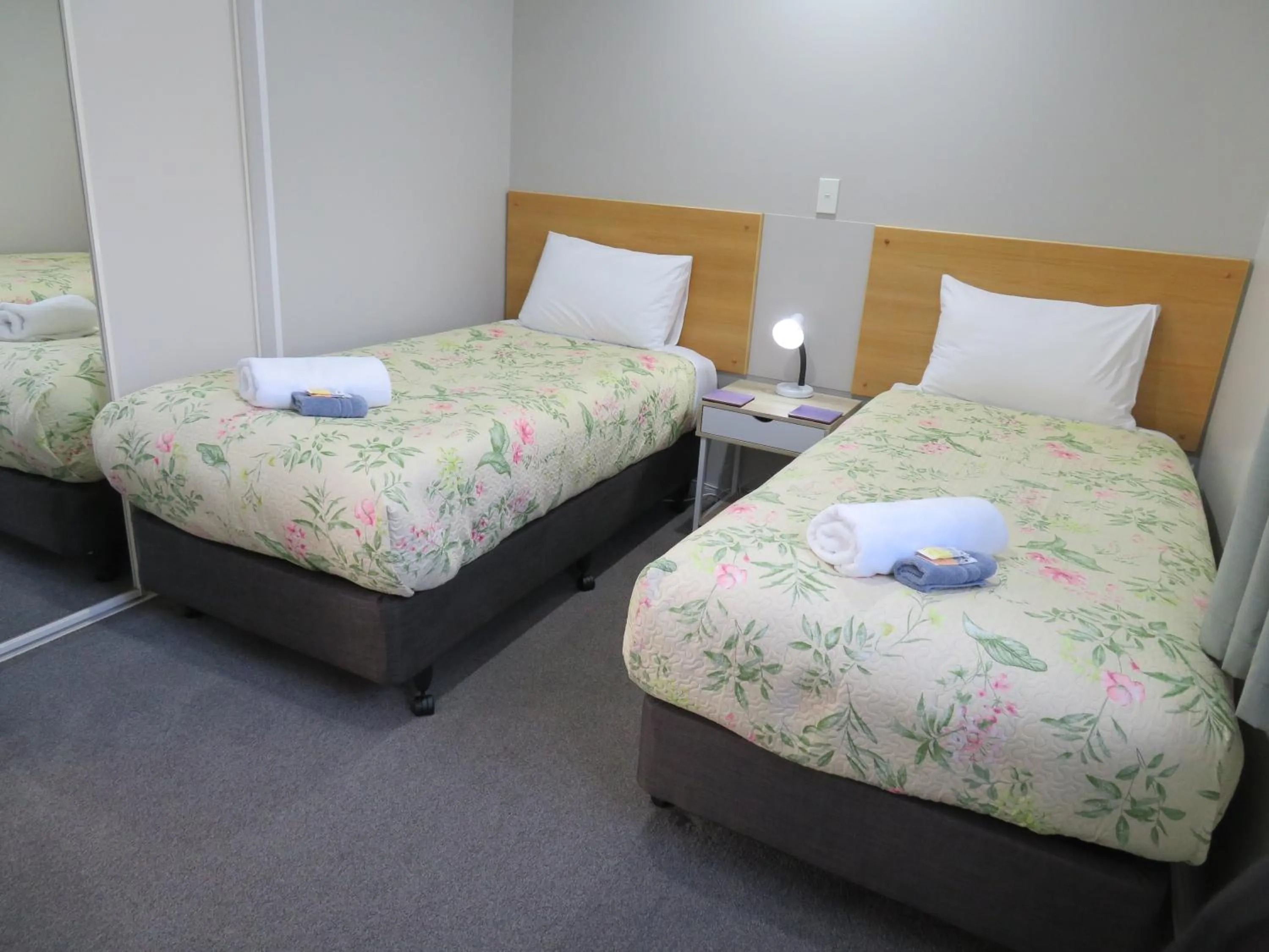 Bed in Commodore Court Motel