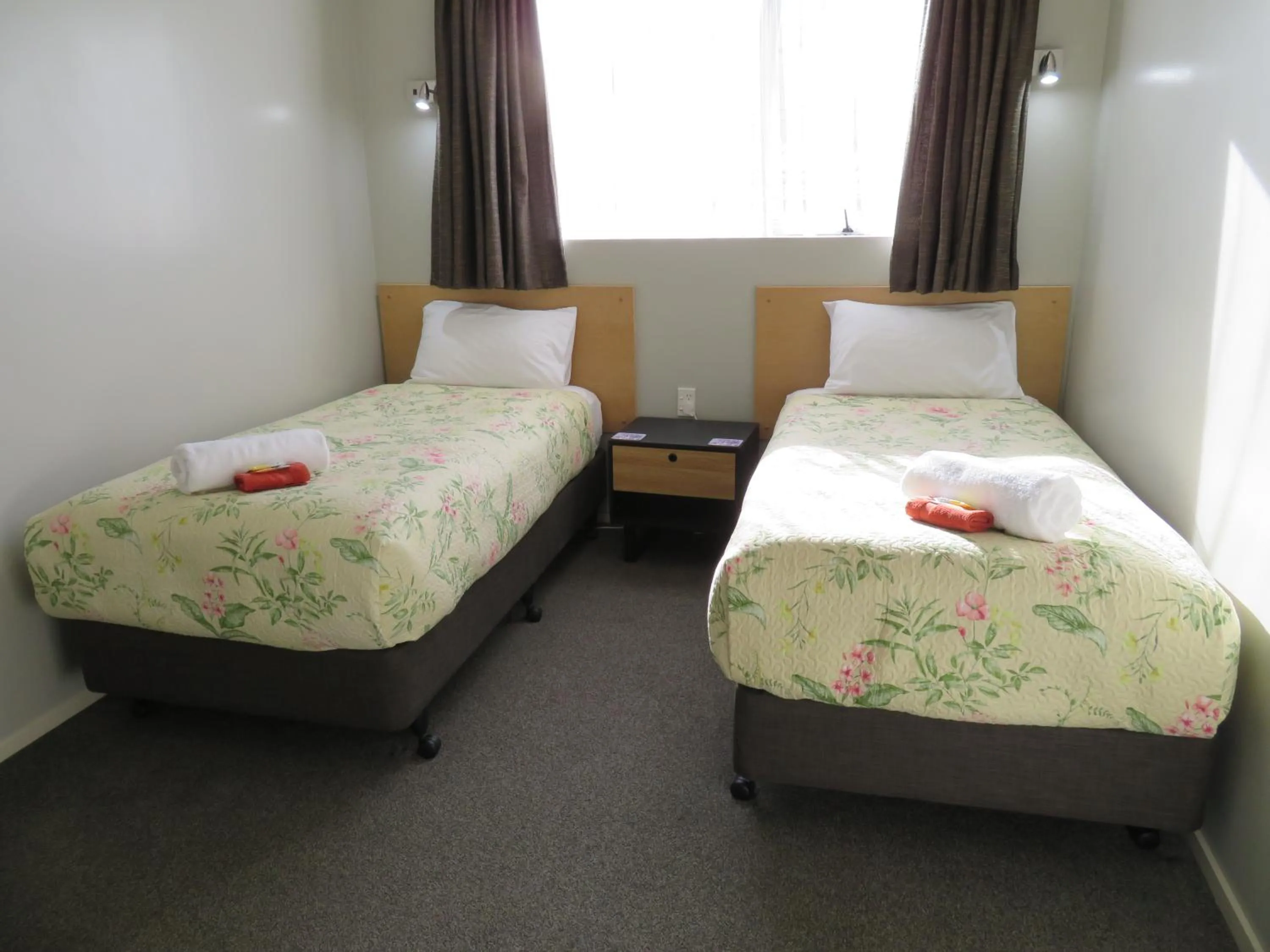 Bed in Commodore Court Motel