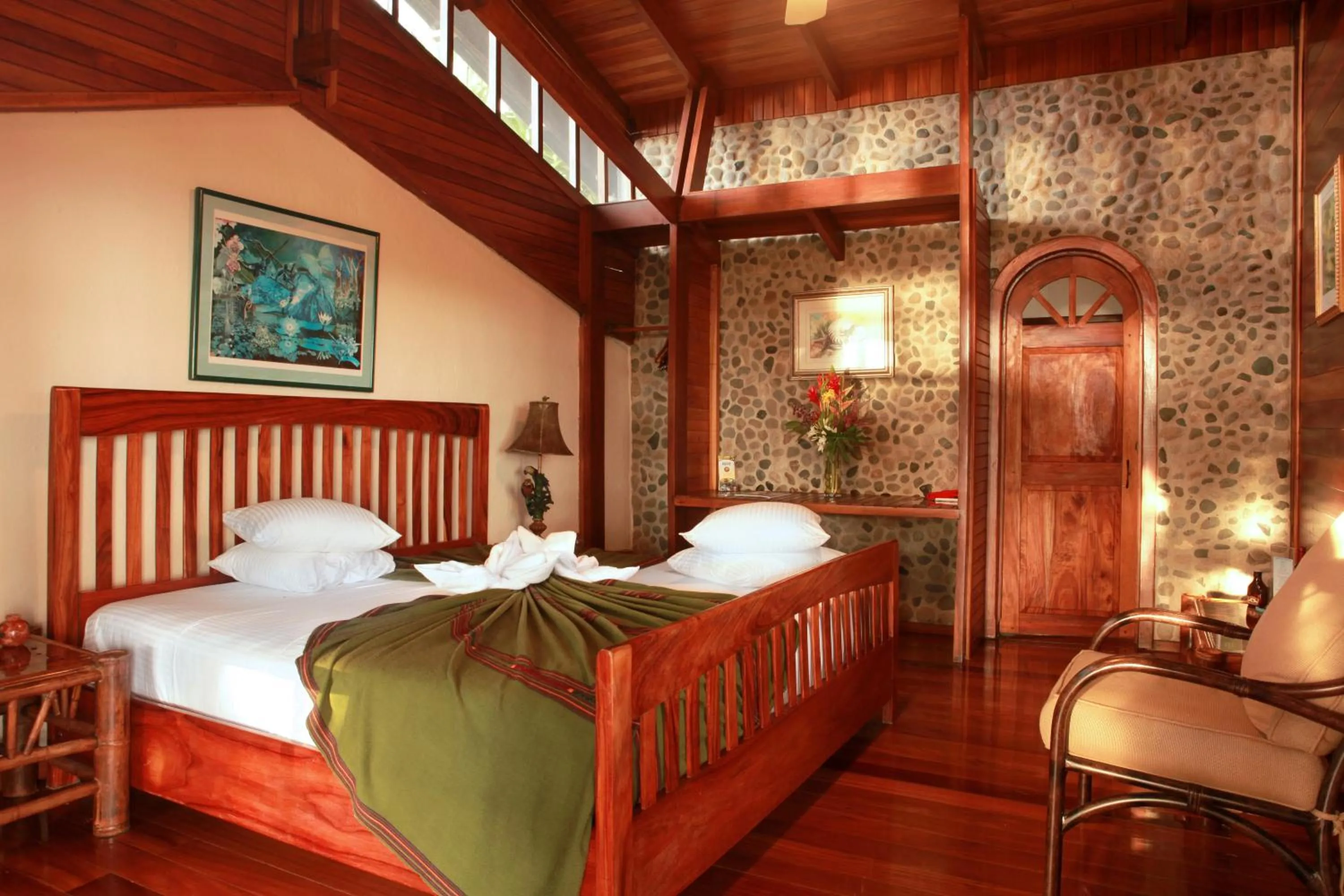 Bed in Aguila de Osa Rainforest Lodge