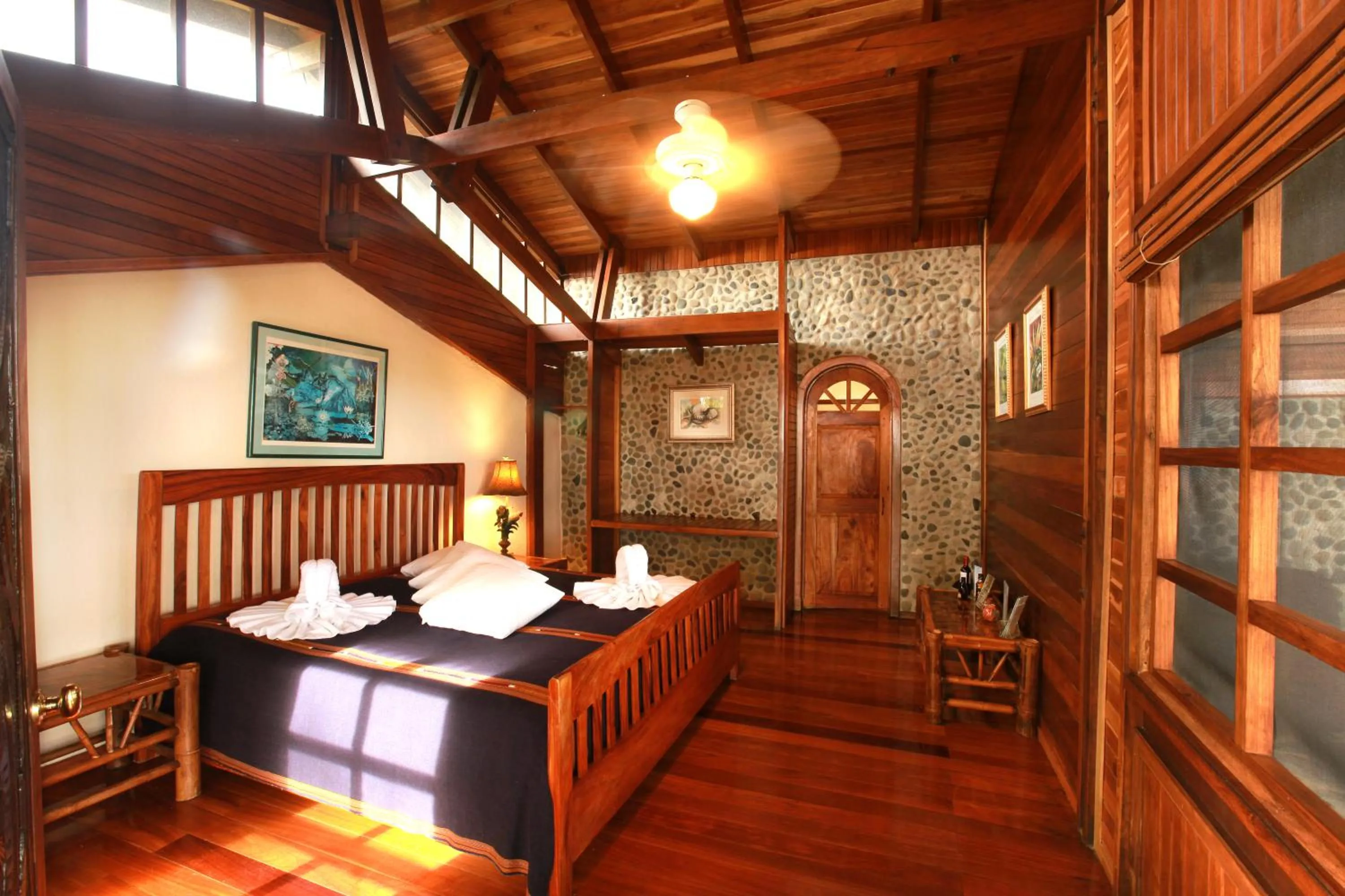 Bed in Aguila de Osa Rainforest Lodge