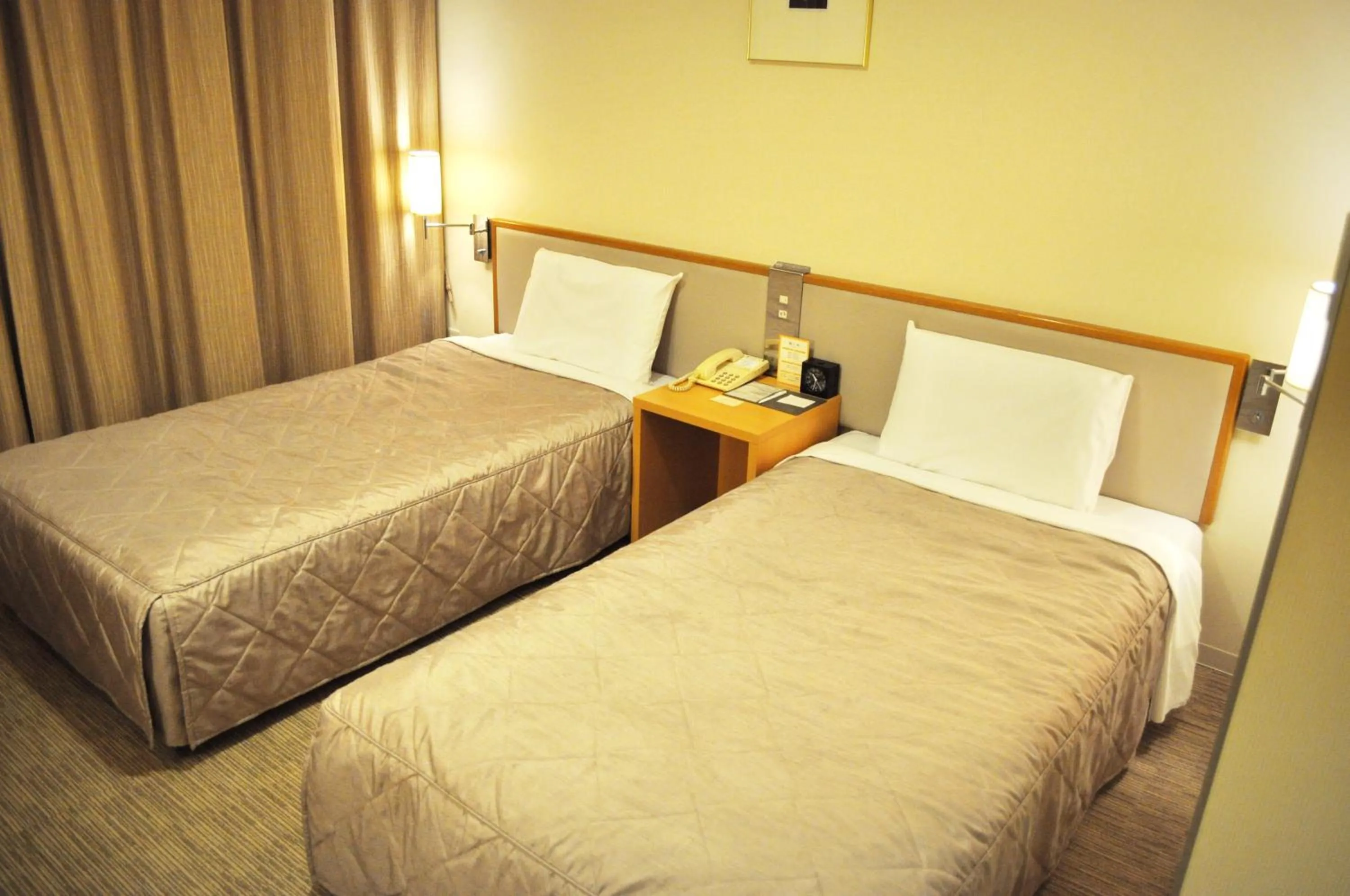 Decorative detail, Bed in Hotel Sunroute Kumamoto