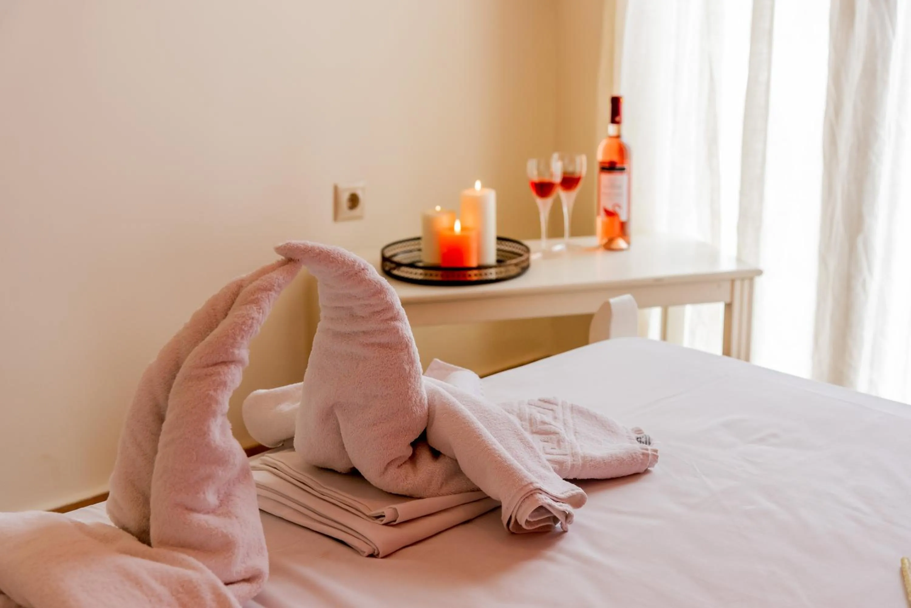 Bed in Almyra Apartments & Suites