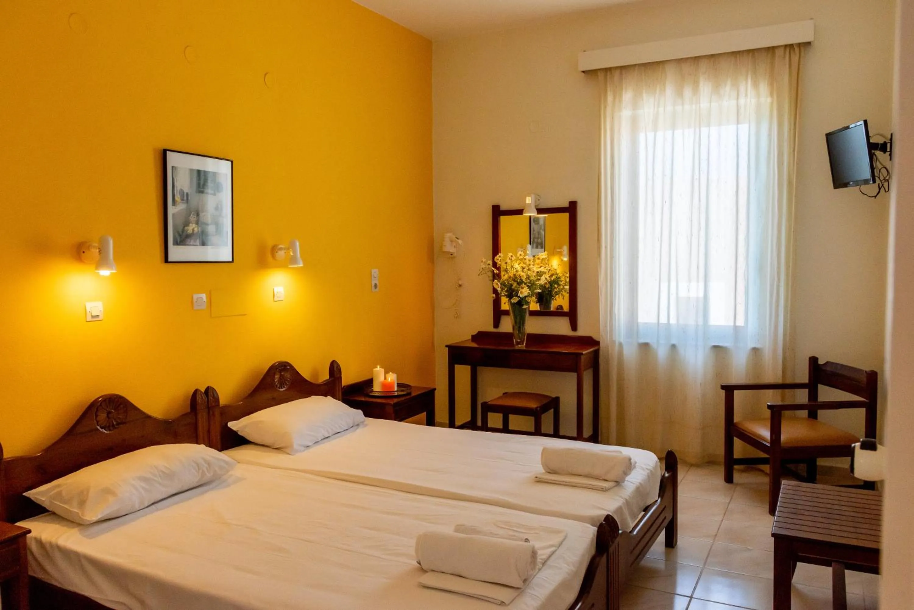 Bed in Almyra Apartments & Suites