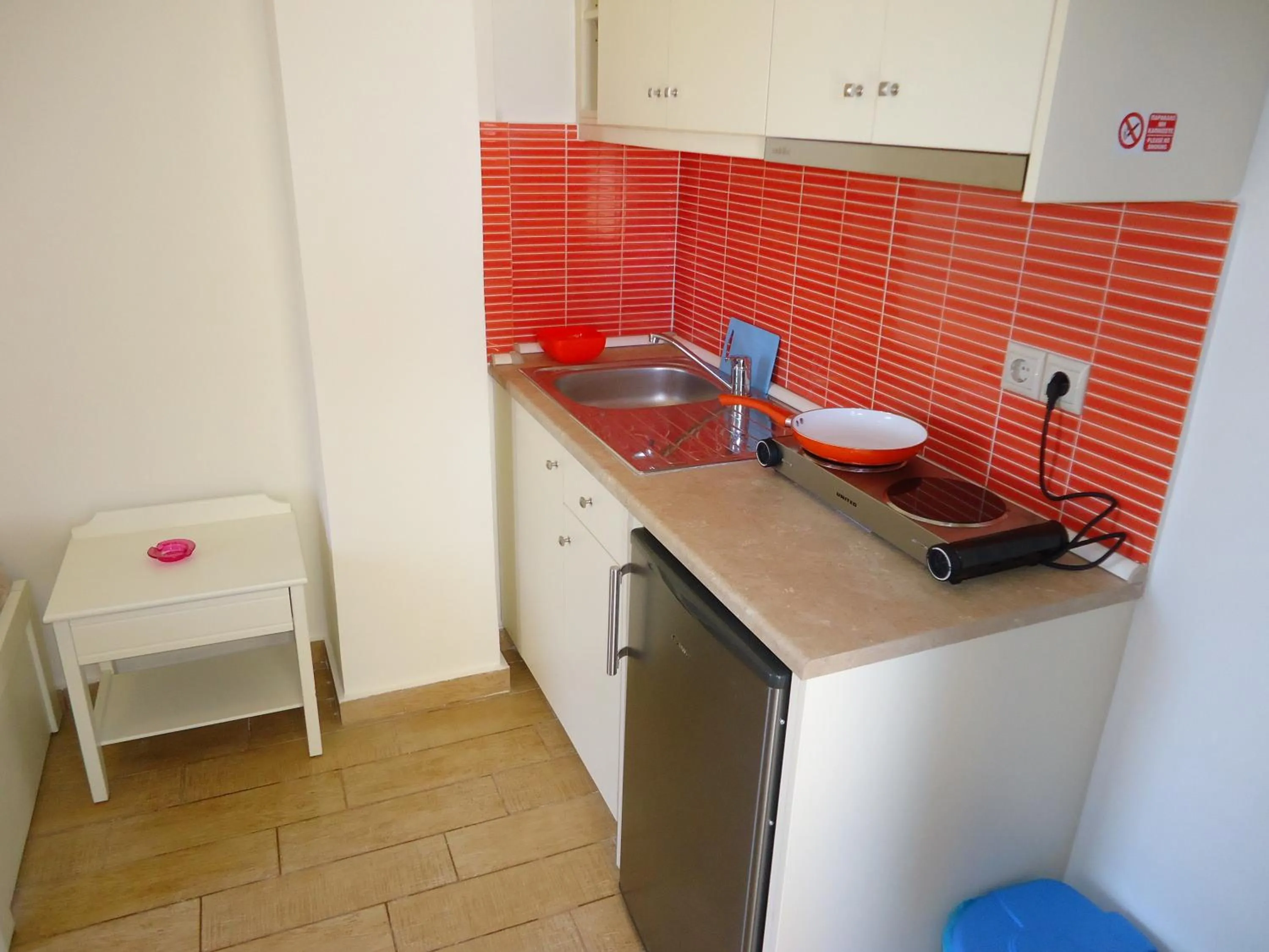 Kitchen or kitchenette in Almyra Apartments & Suites