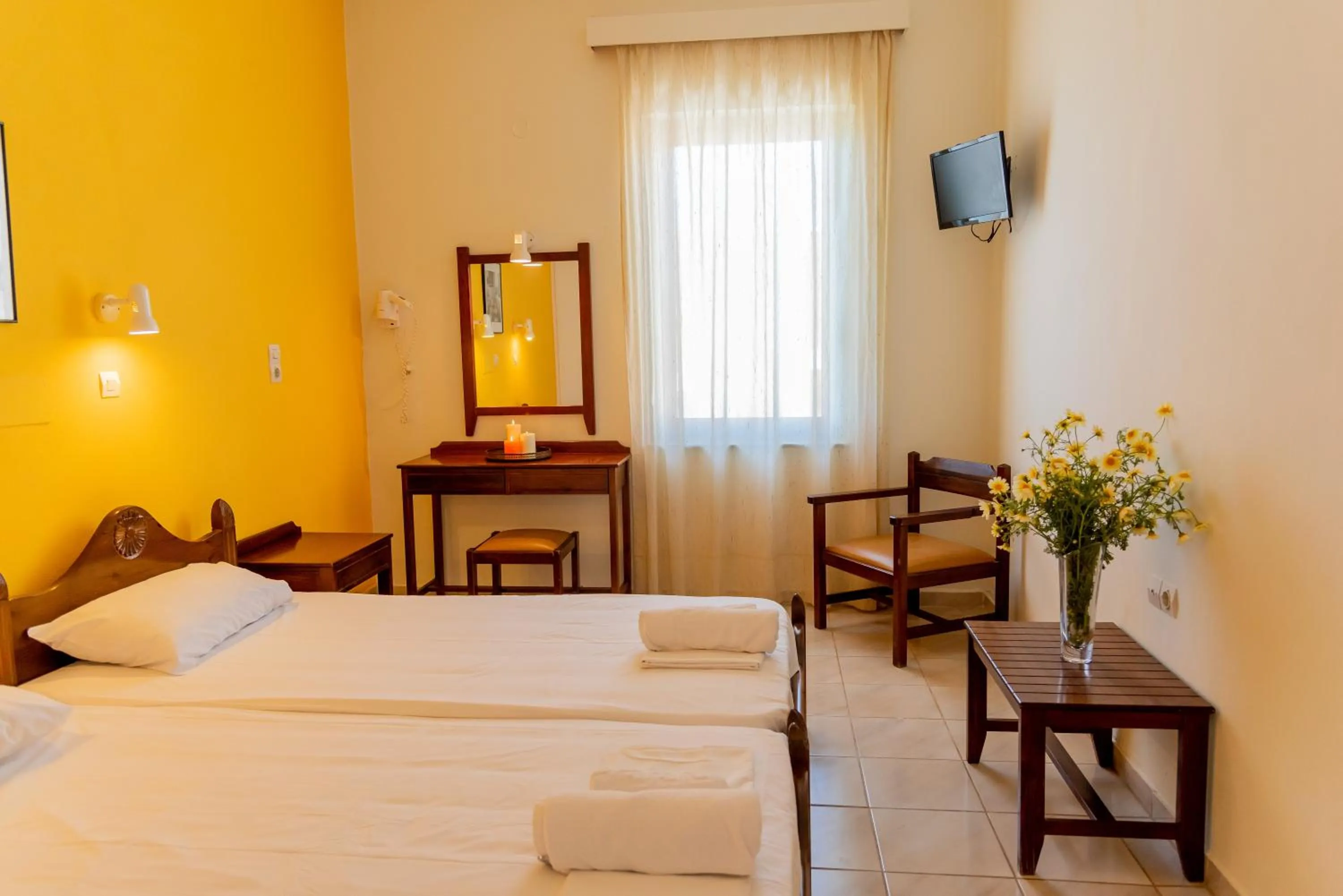 Bed in Almyra Apartments & Suites