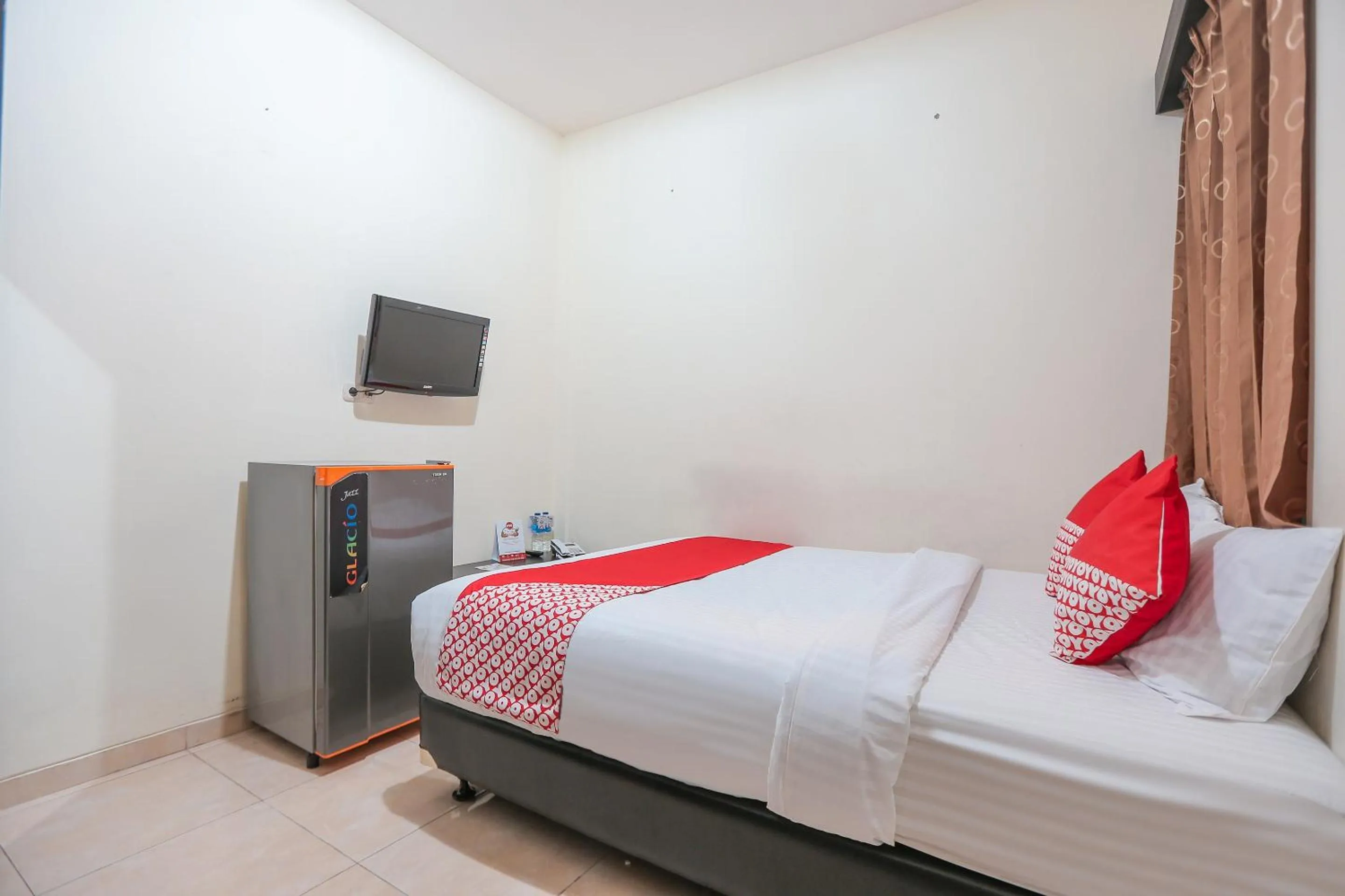 Bedroom in OYO 122 Oekude Kost