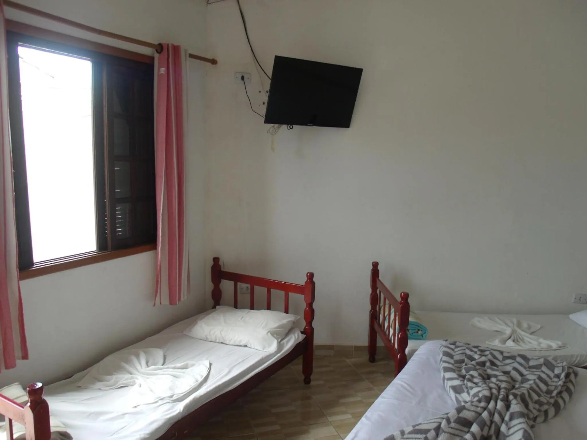 Bed in Pousada Edson