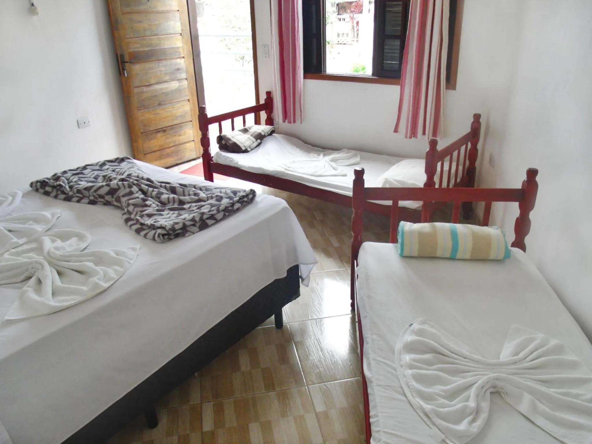 Bed in Pousada Edson