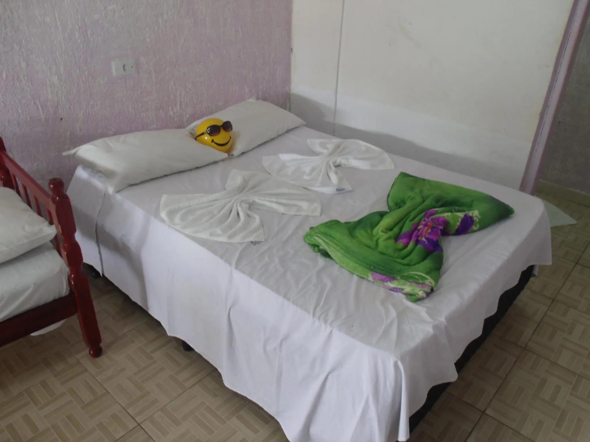 Bed in Pousada Edson