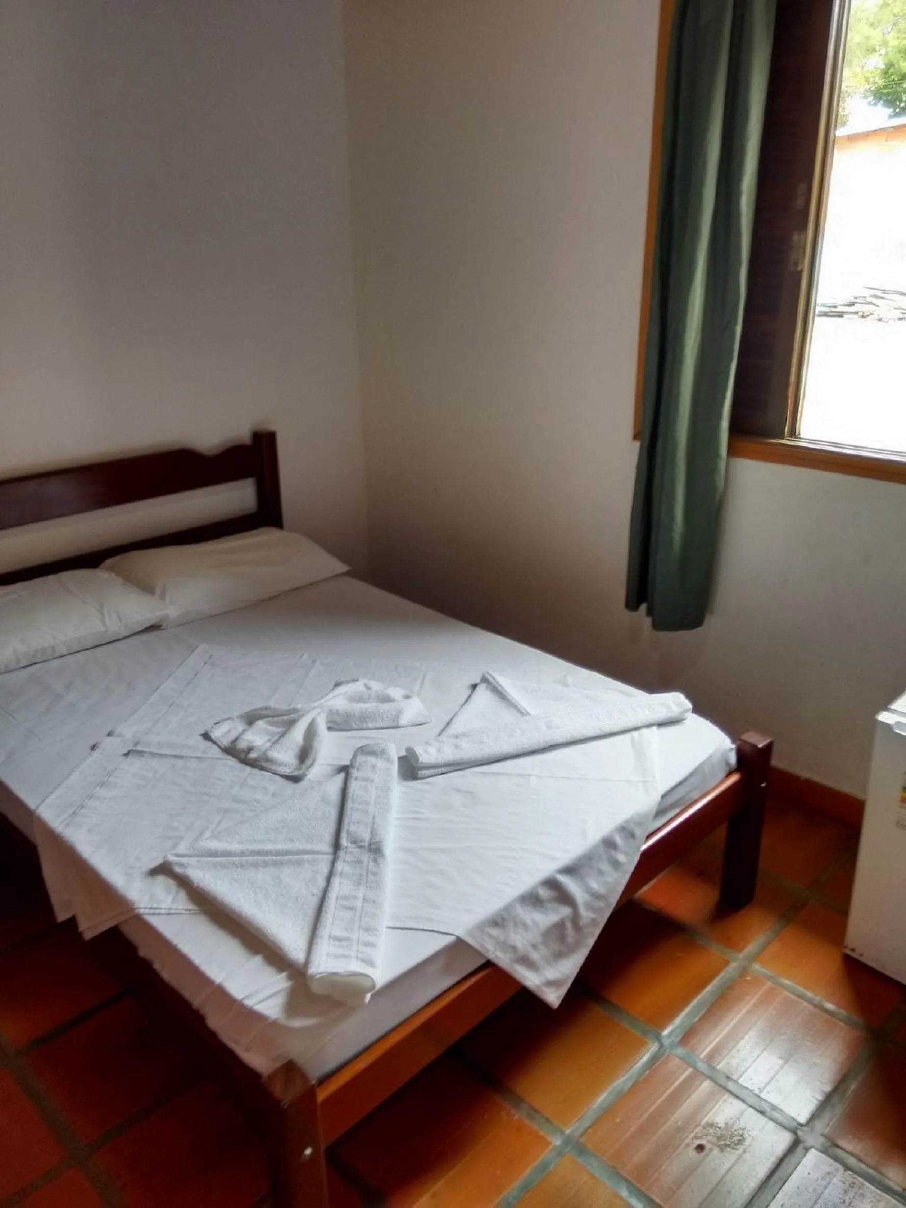 Bed in Pousada Edson