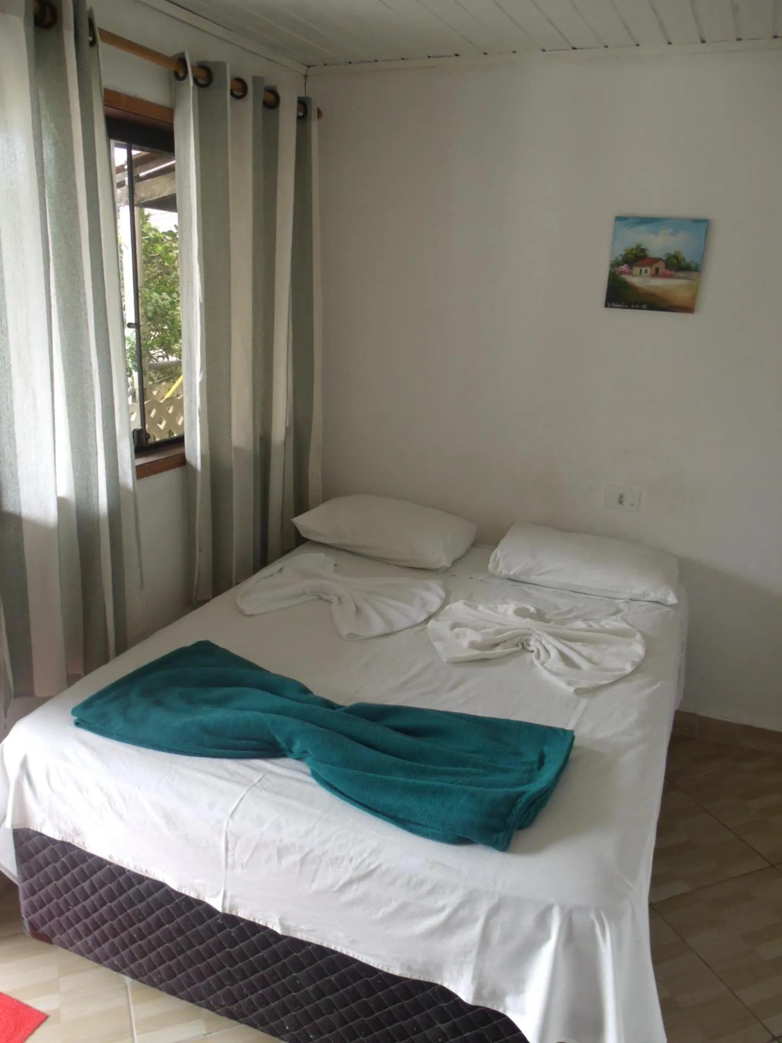 Bed in Pousada Edson