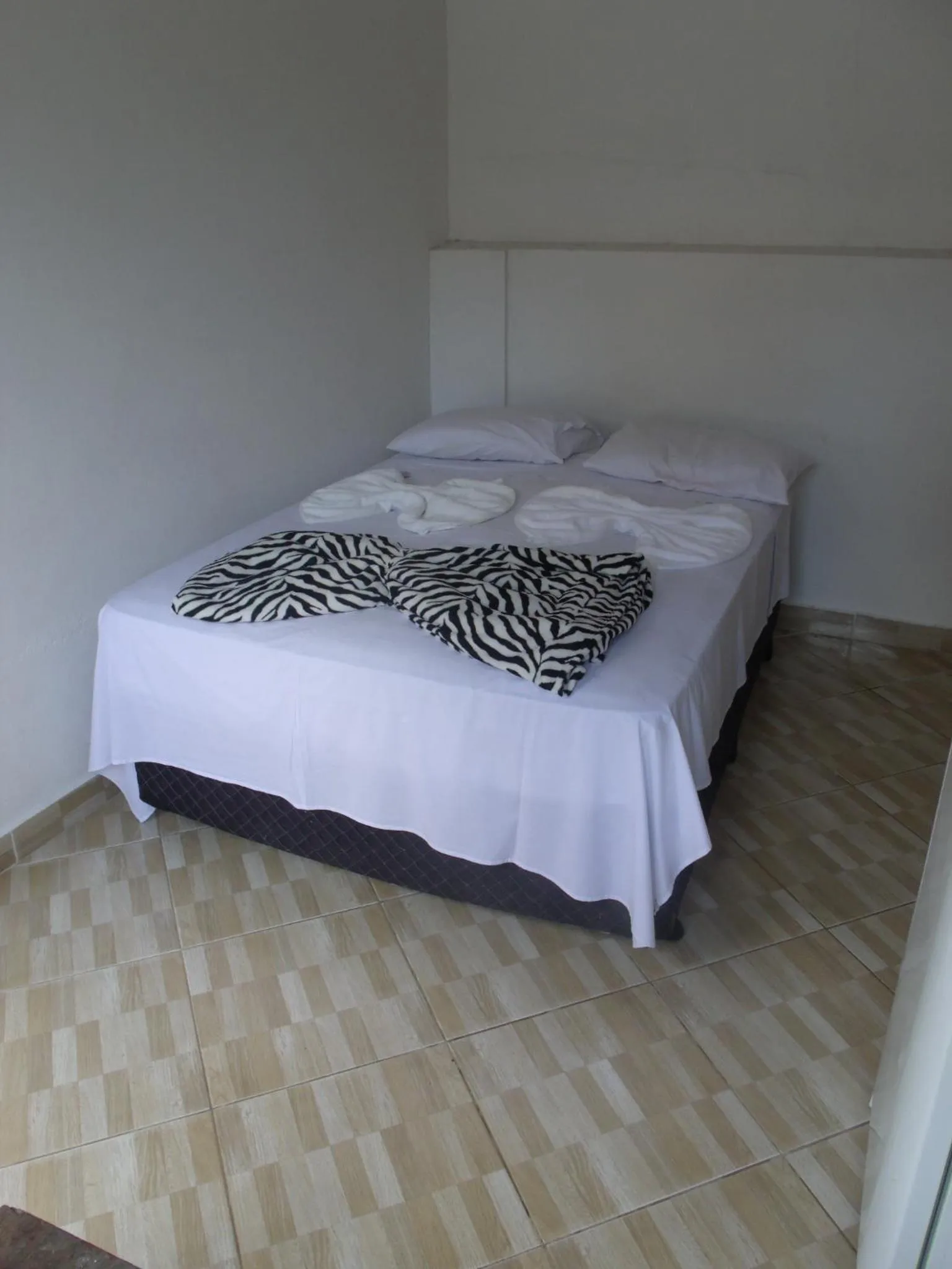 Bed in Pousada Edson