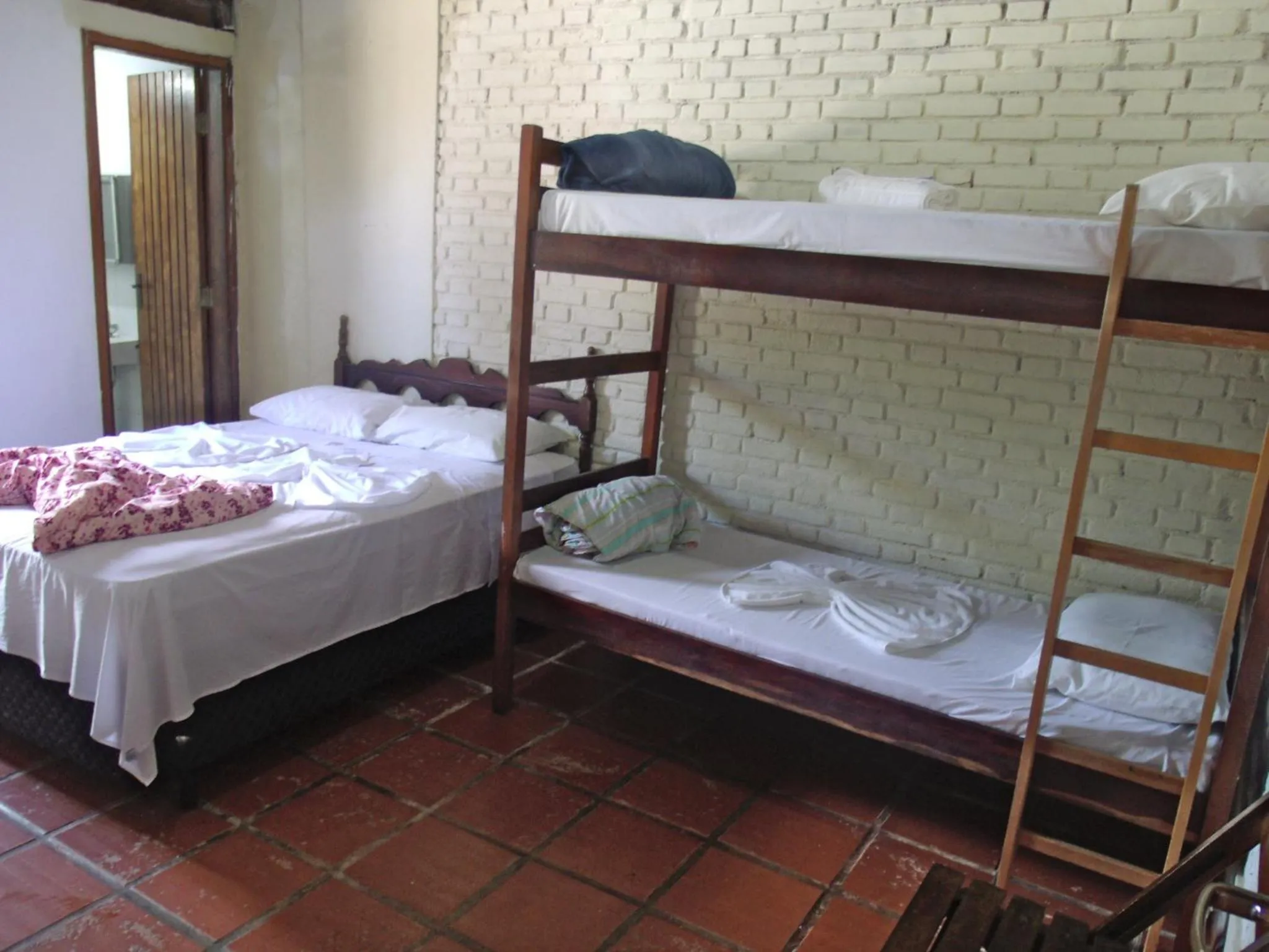 Bed in Pousada Edson