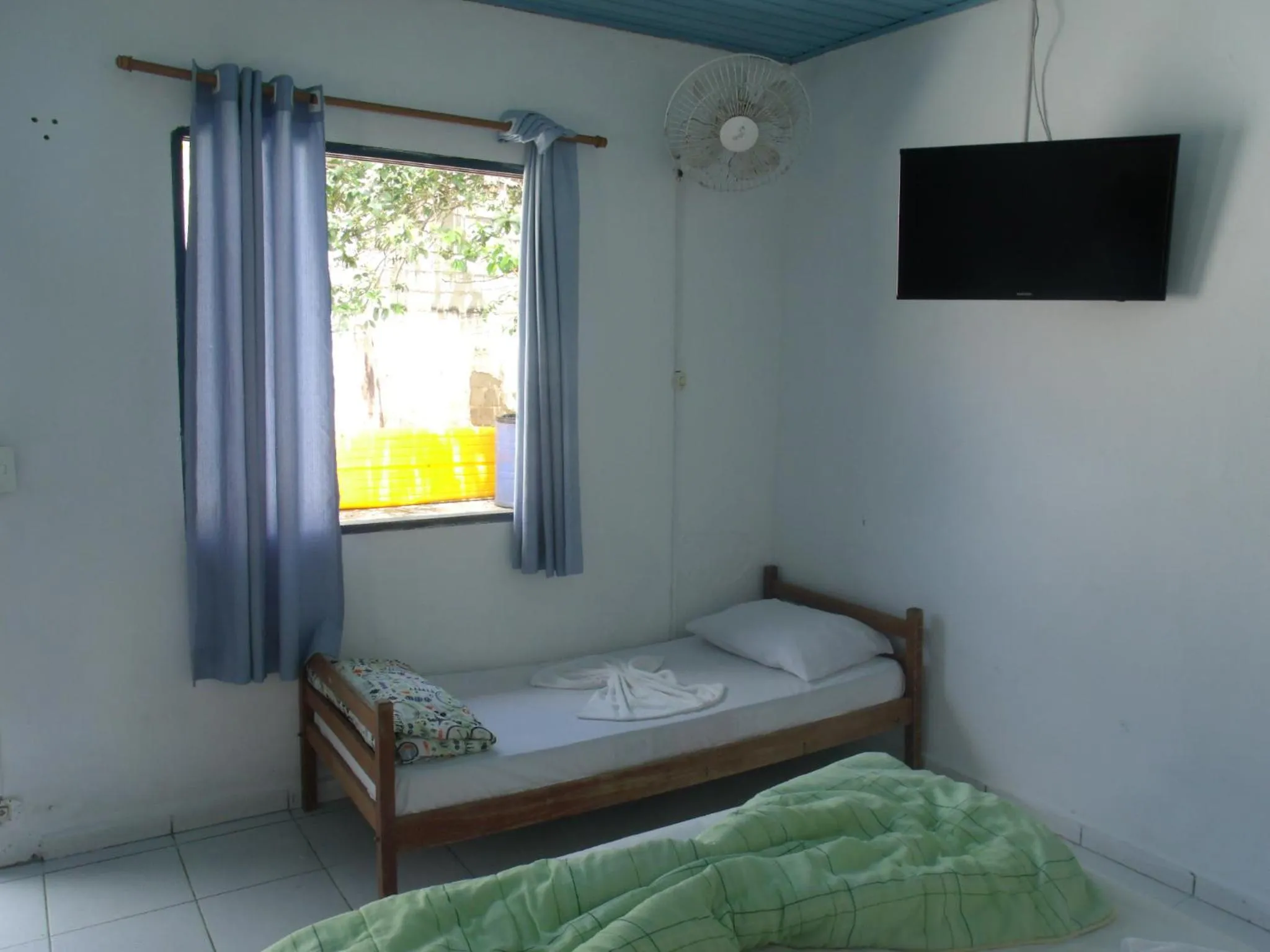 Bed in Pousada Edson