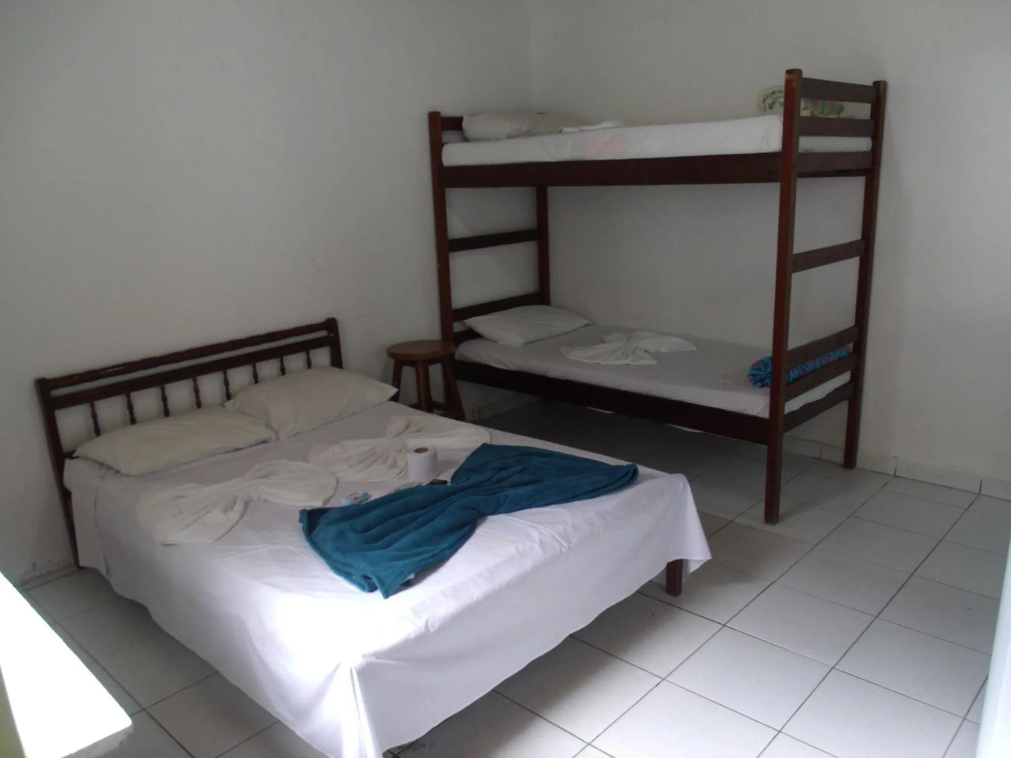 Bed in Pousada Edson