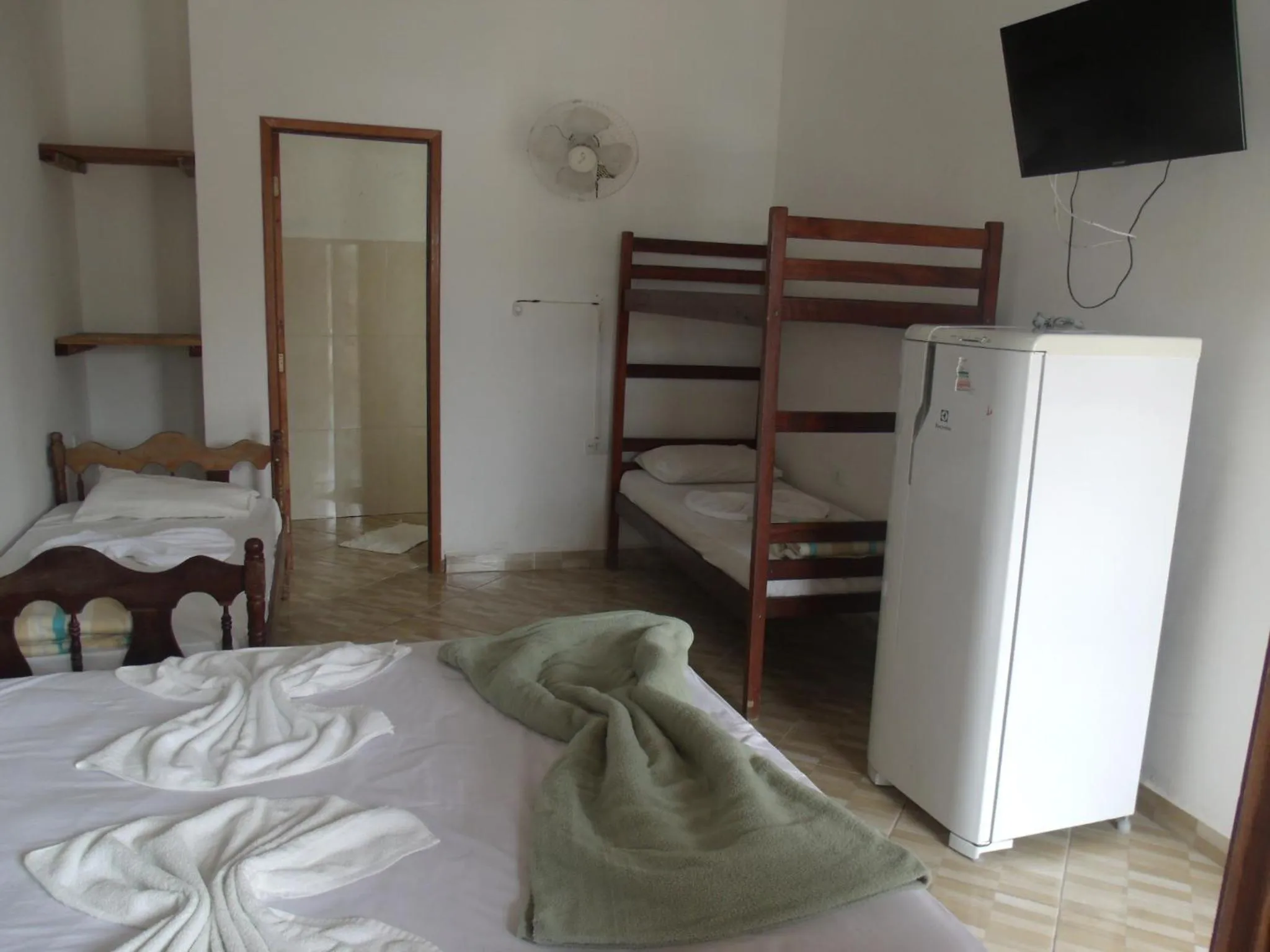 Bed in Pousada Edson