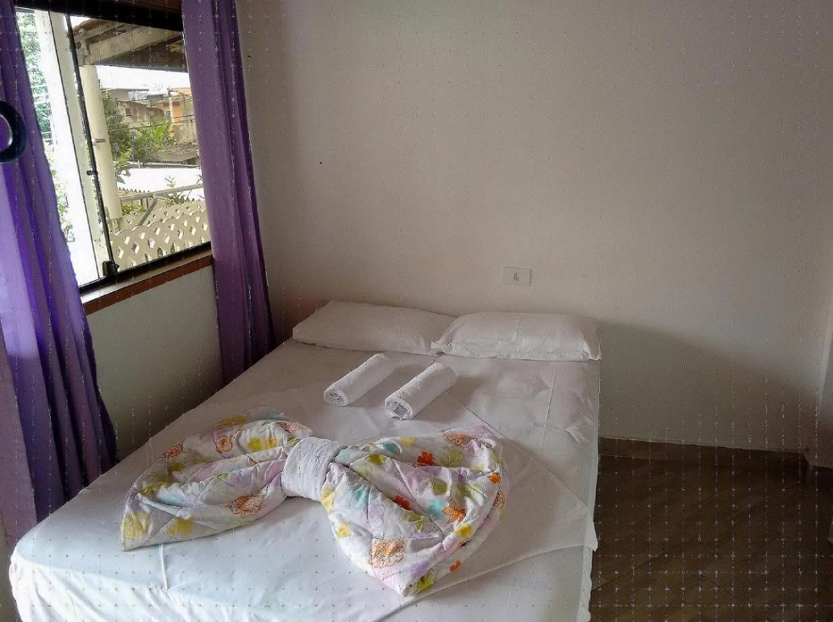 Bed in Pousada Edson