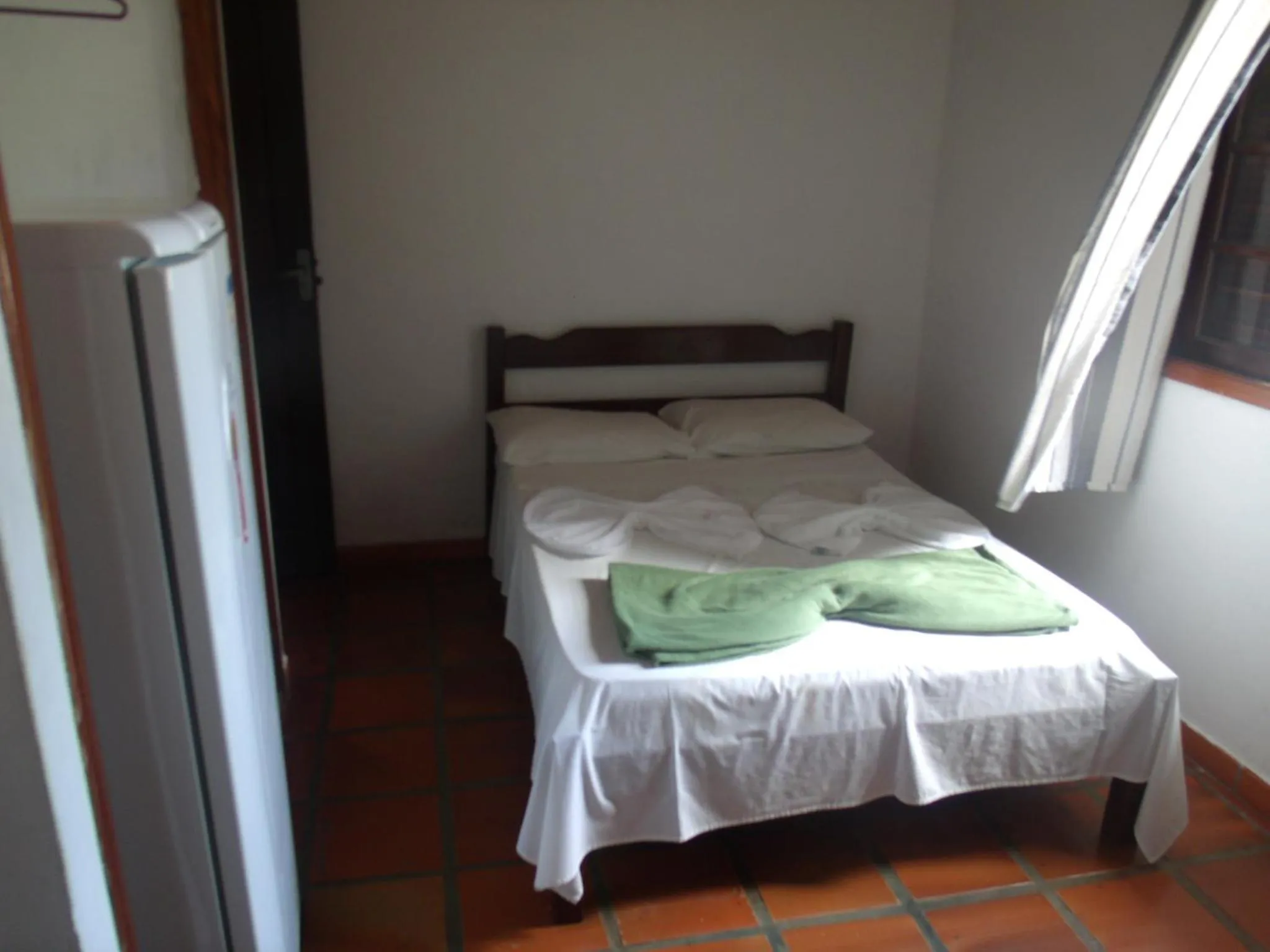 Bed in Pousada Edson