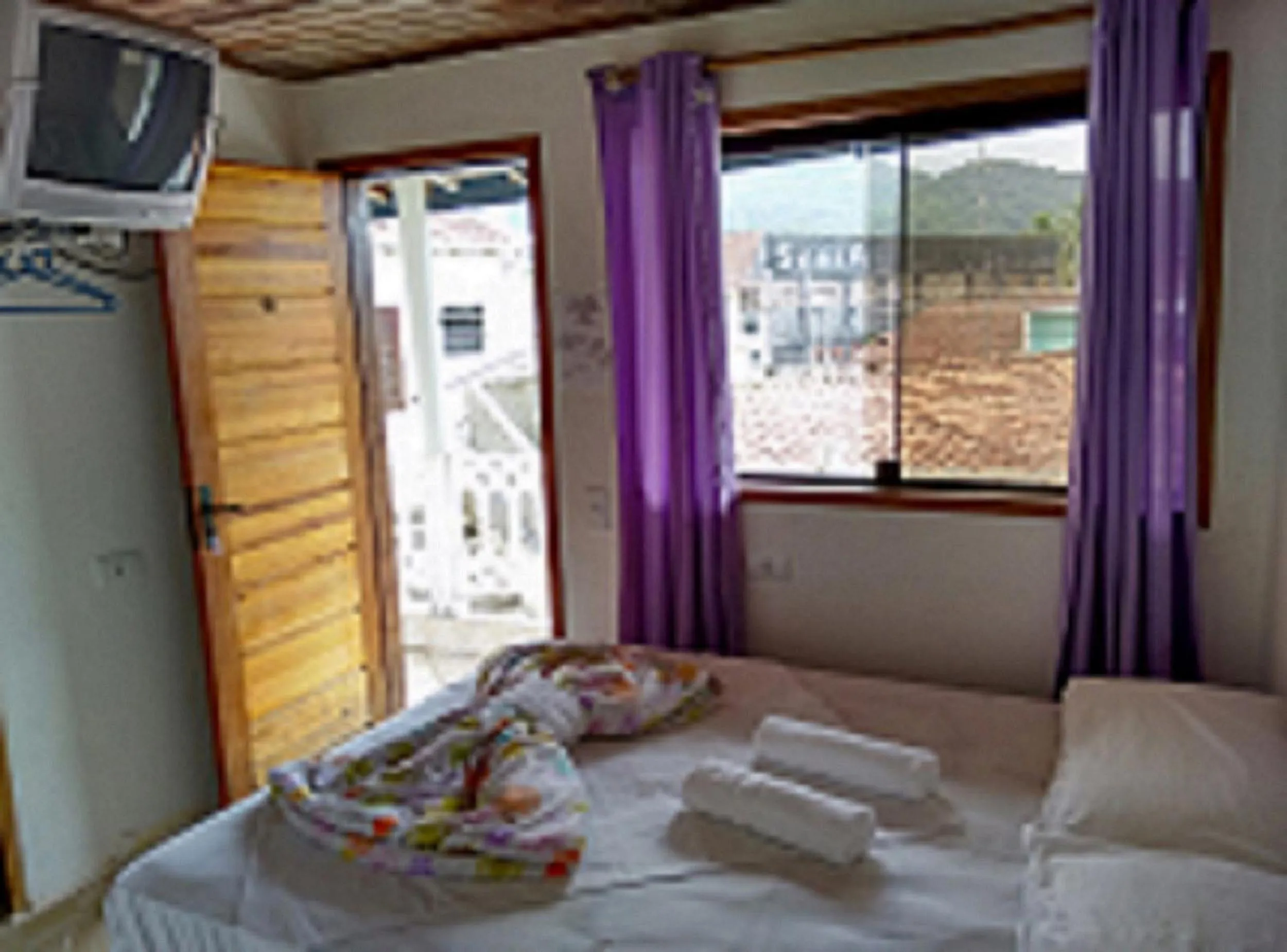 Bed in Pousada Edson