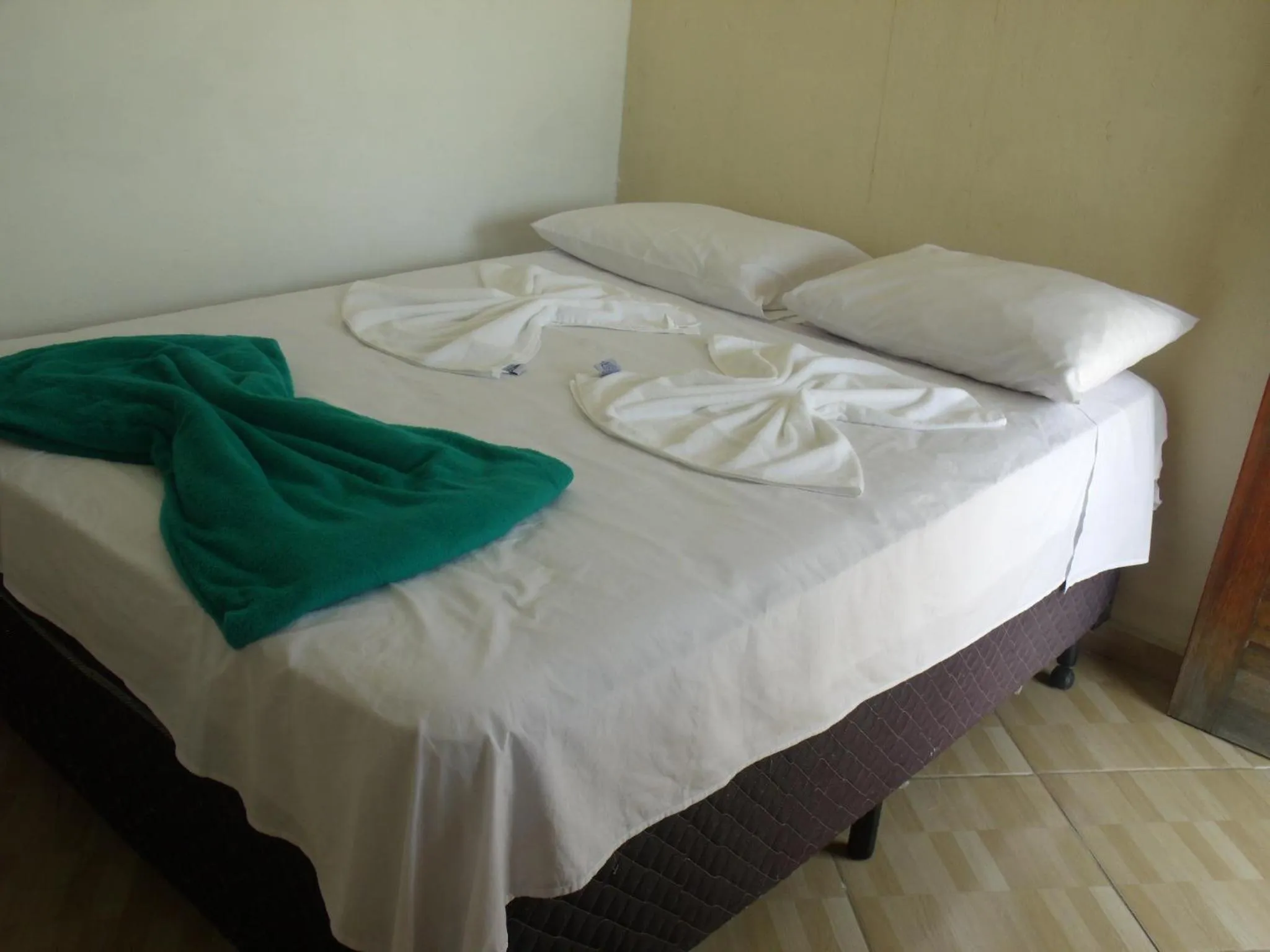 Bed in Pousada Edson