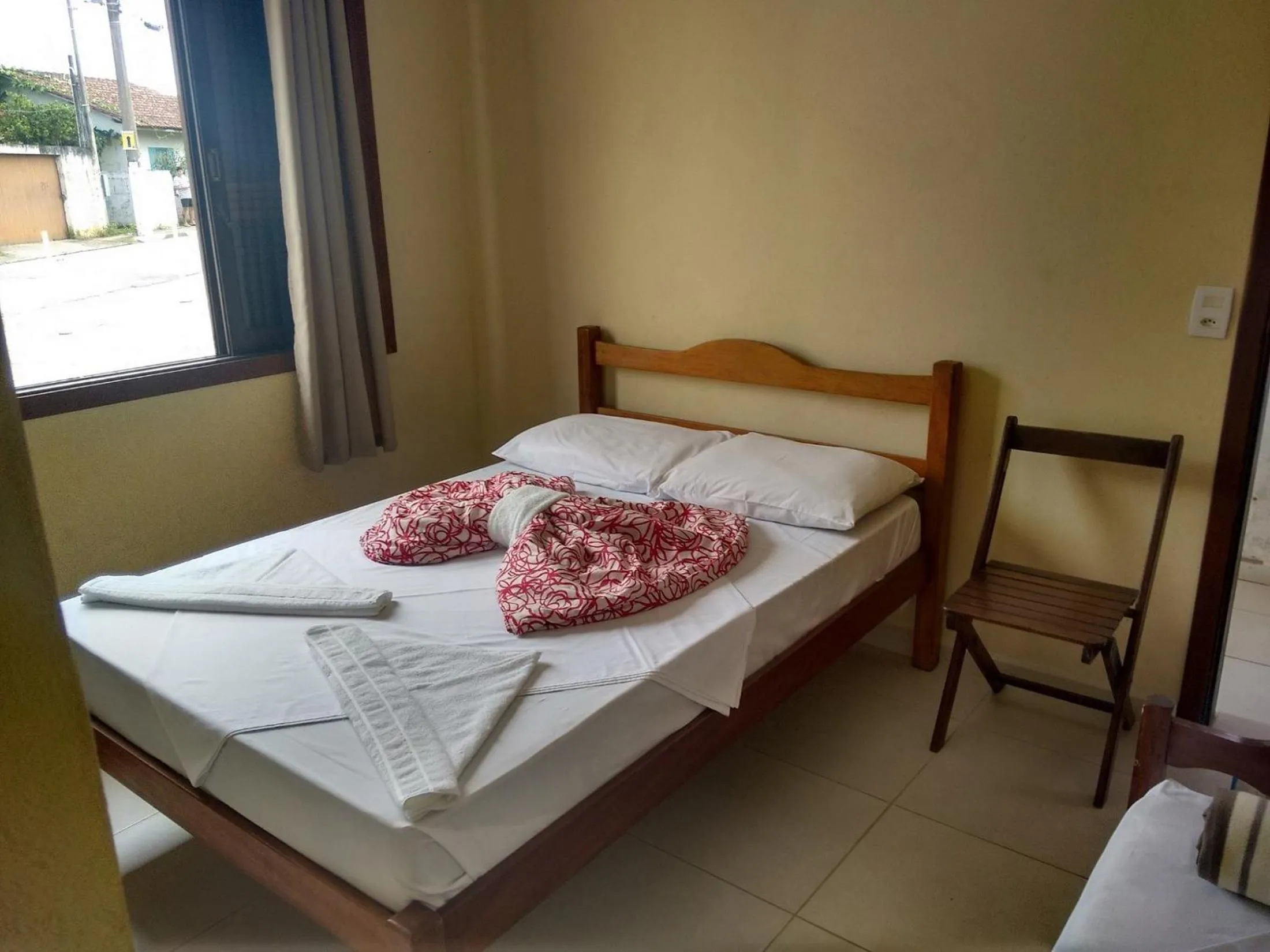 Bed in Pousada Edson