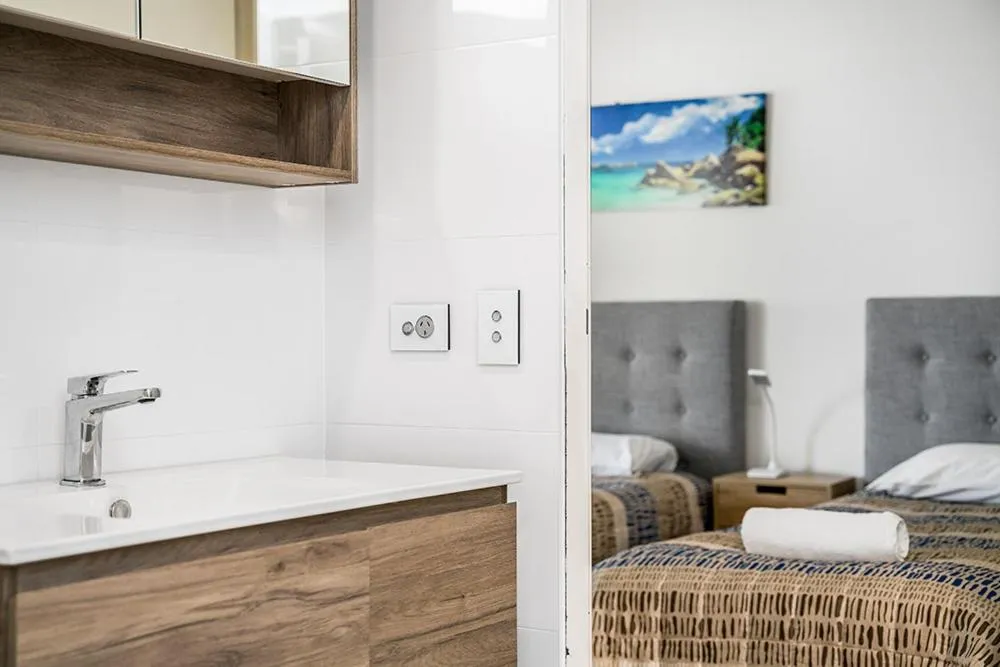 Bathroom, Bed in Rainbow Bay Resort Holiday Apartments