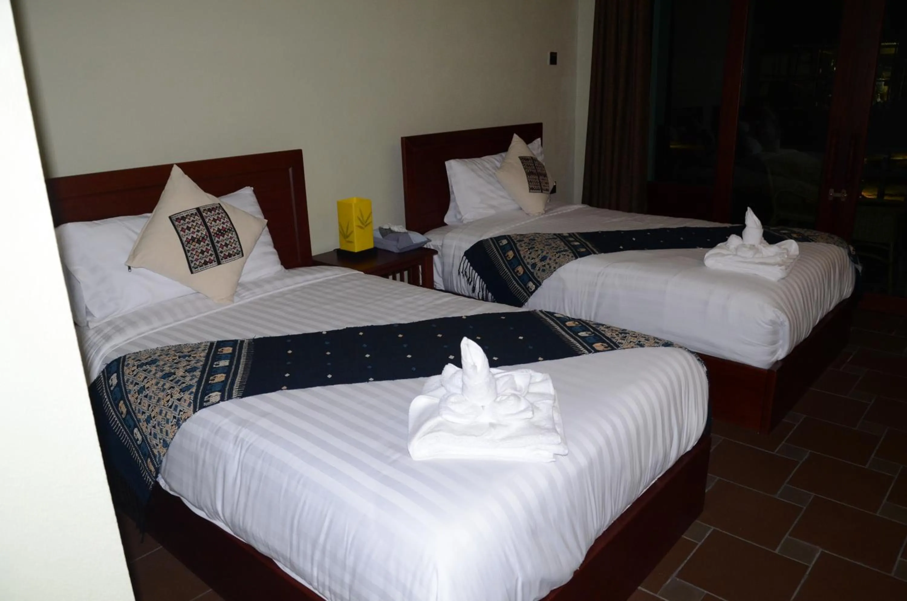 Bed in Saksiri Riverside Boutique Hotel