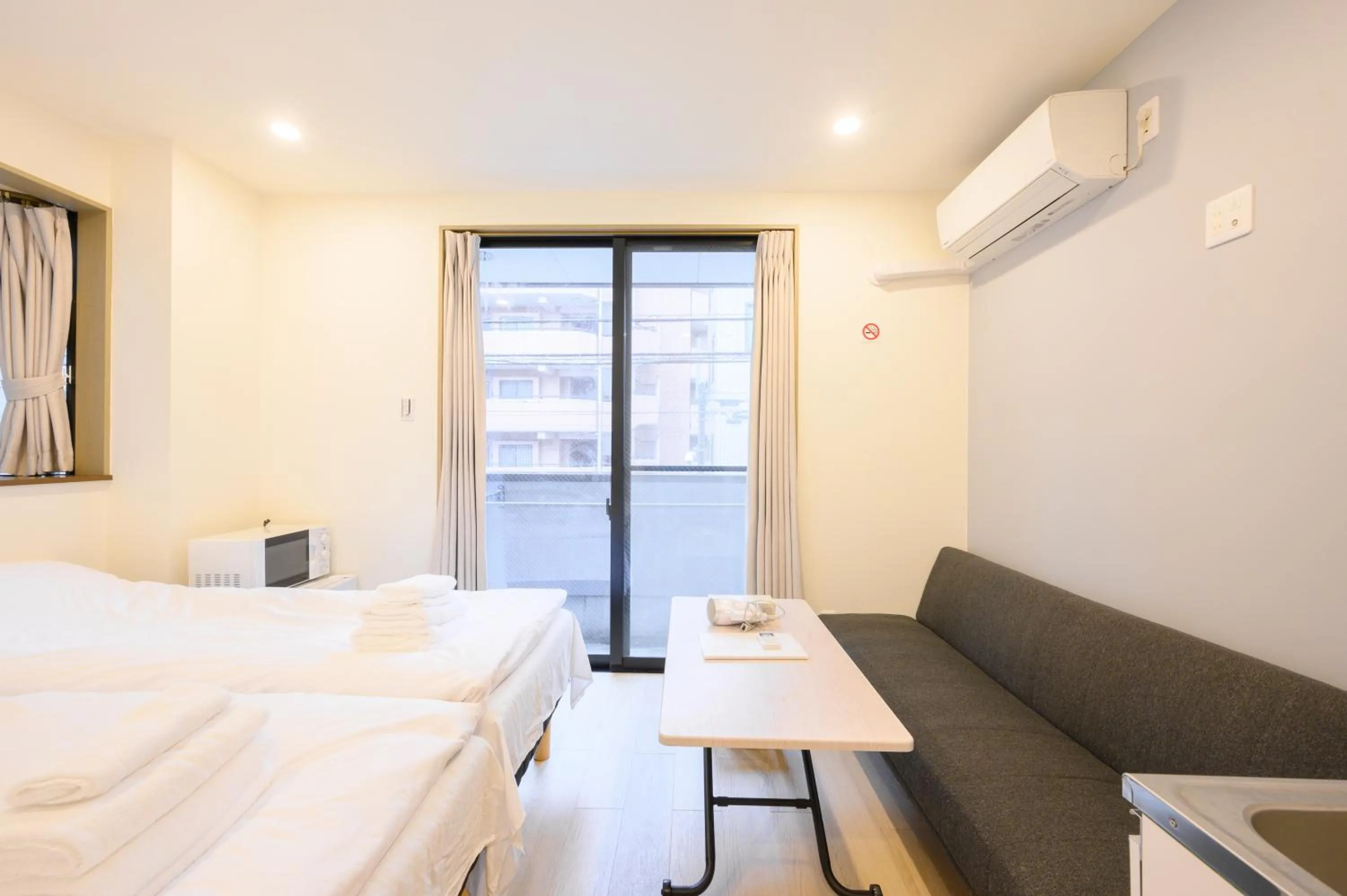 Bed in Oku Apartment