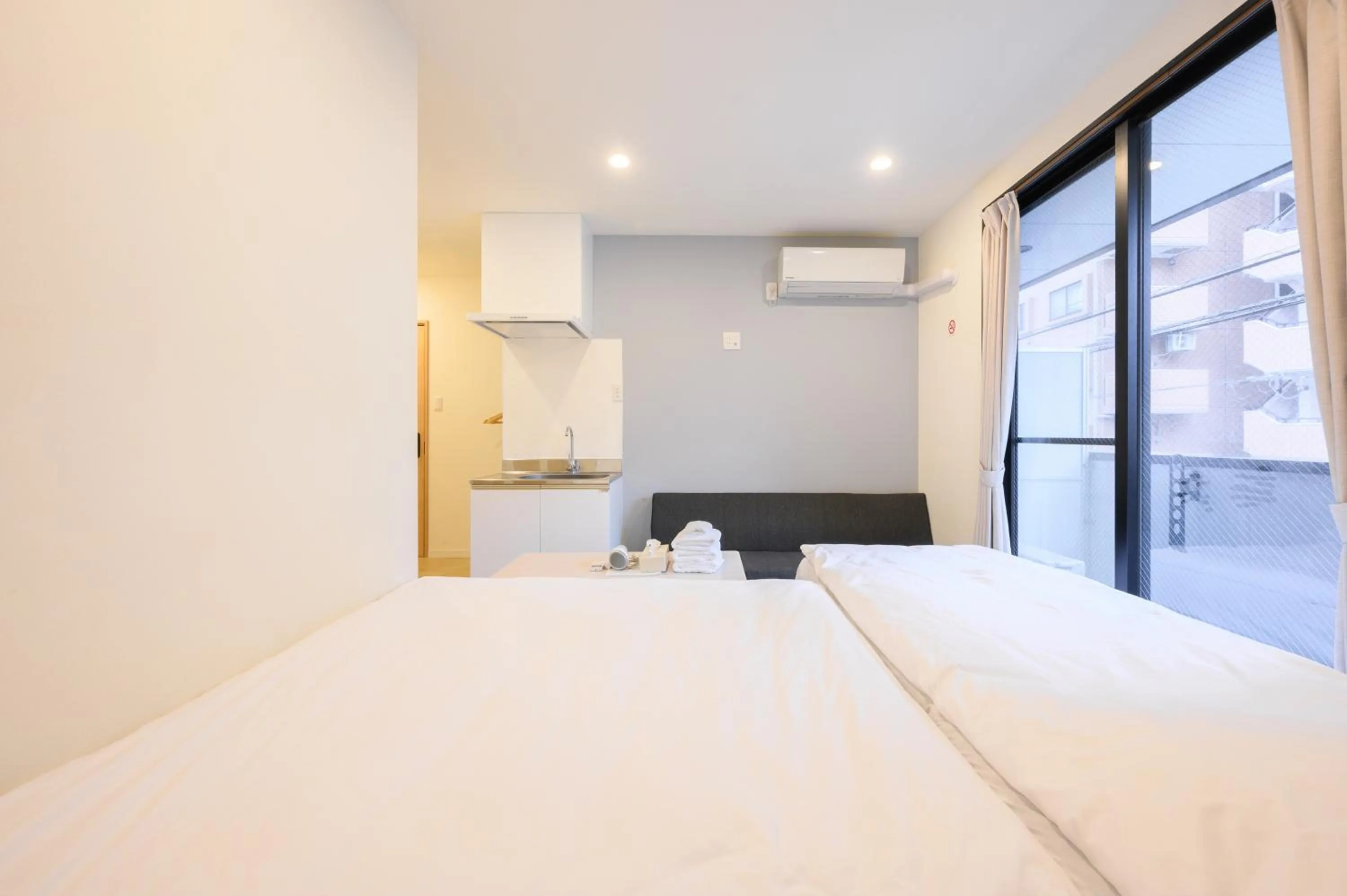 Bed in Oku Apartment