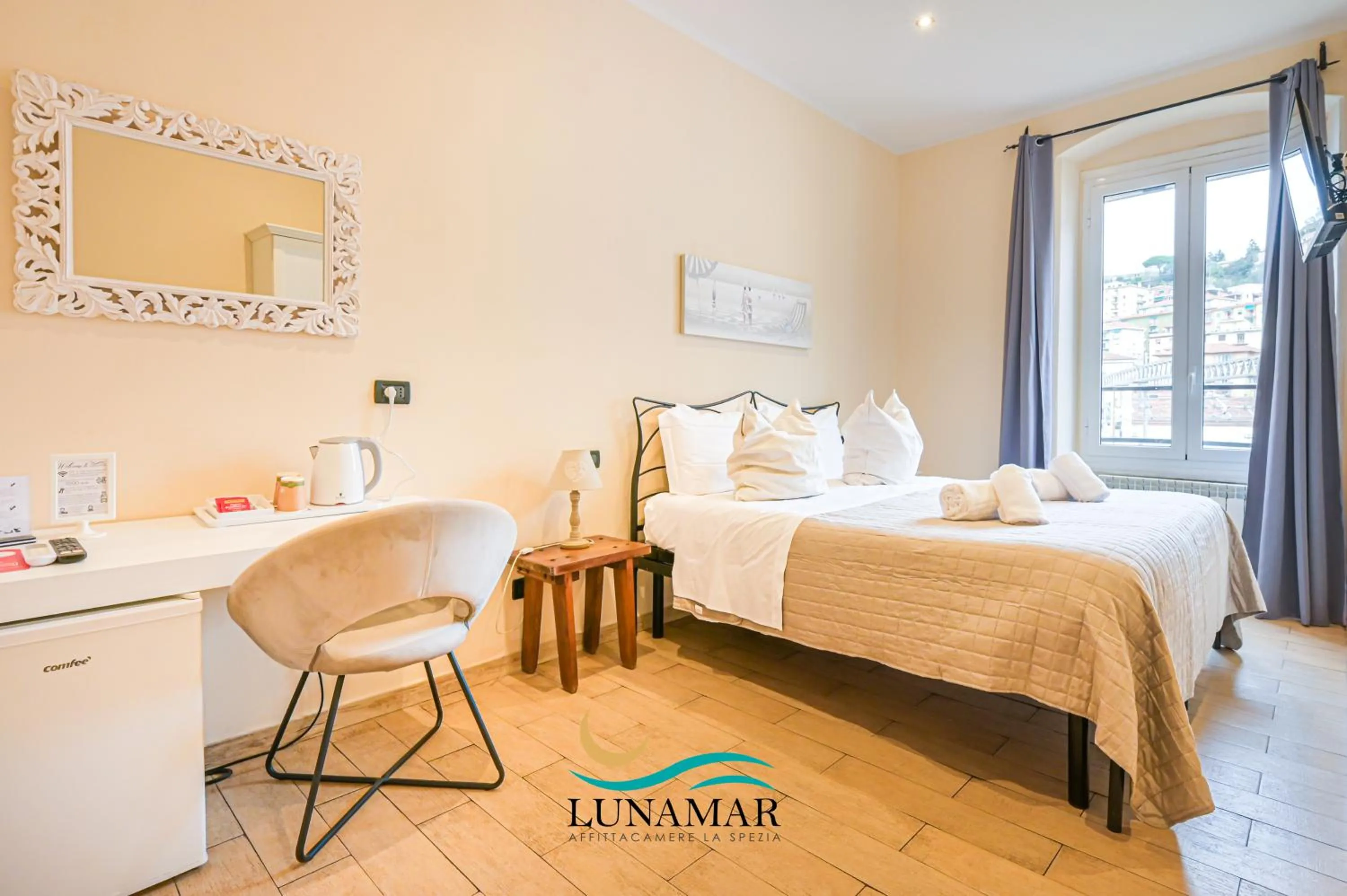 Bed in Affittacamere Lunamar