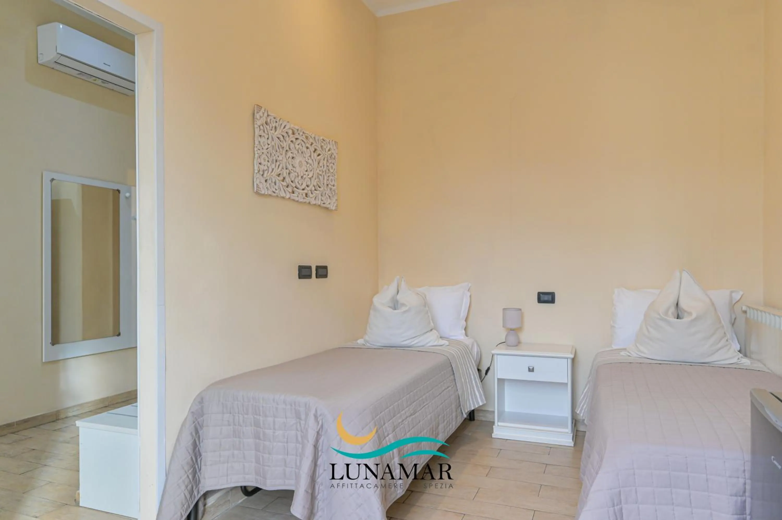 Bed in Affittacamere Lunamar