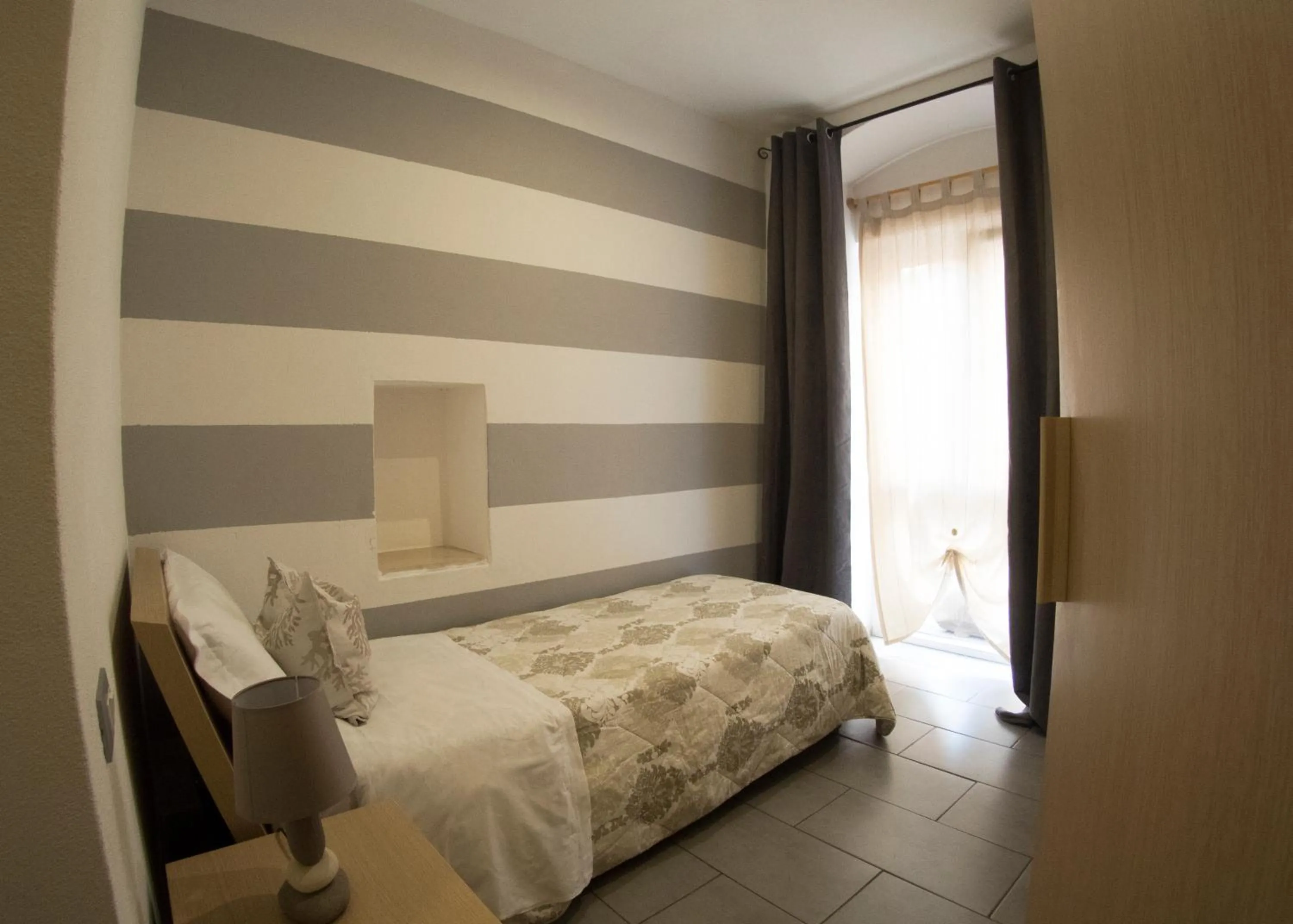 Bed in Affittacamere Lunamar