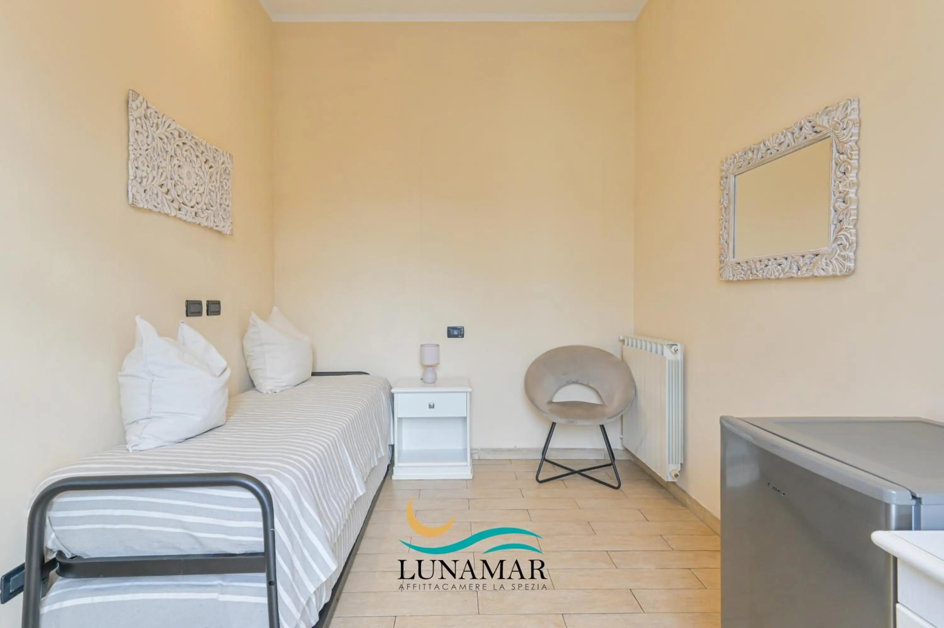 Bed in Affittacamere Lunamar