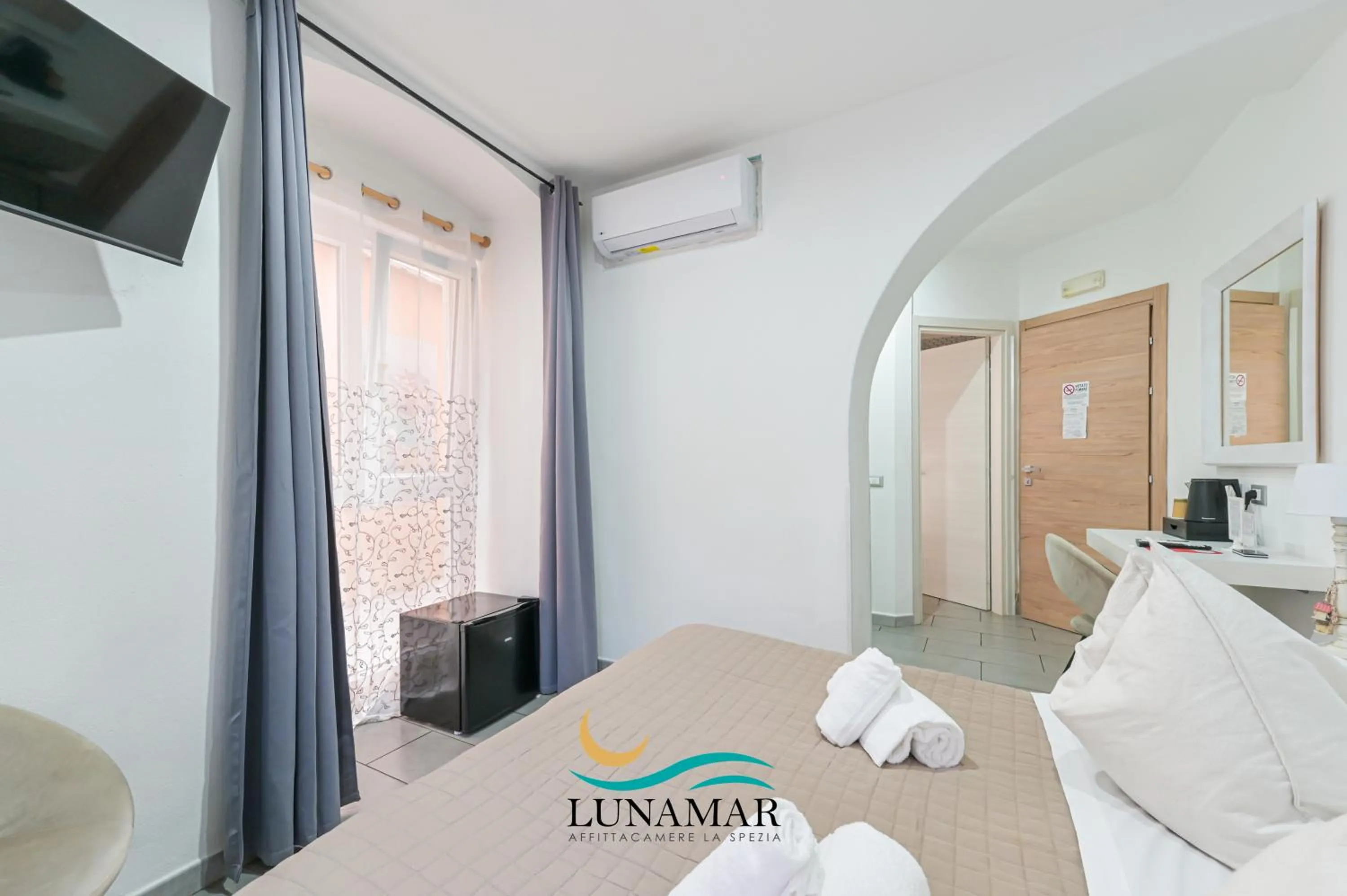 Bed in Affittacamere Lunamar