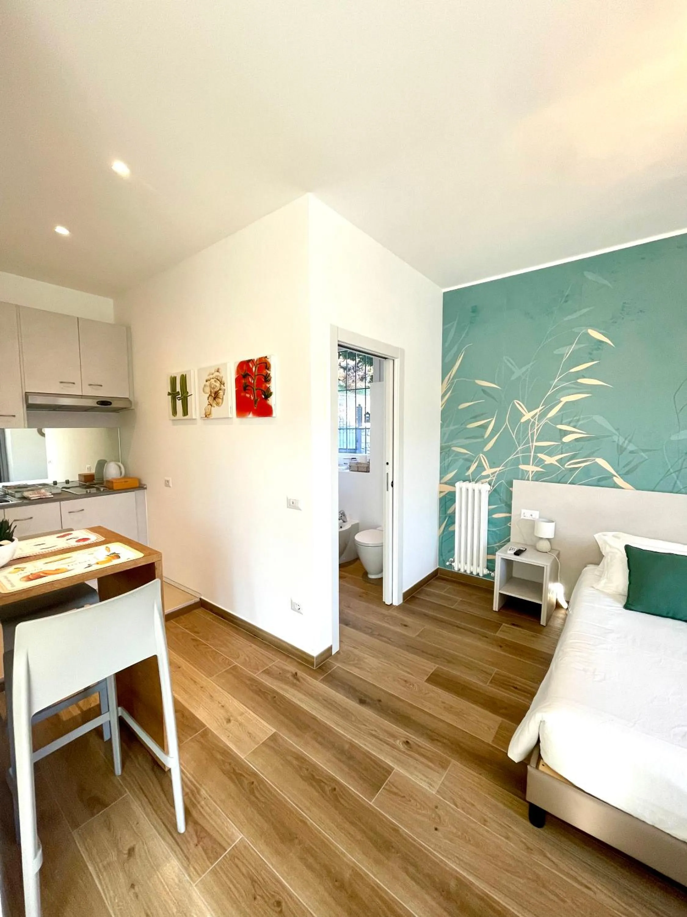 Kitchen or kitchenette, Bed in Hotel Baia di Paré