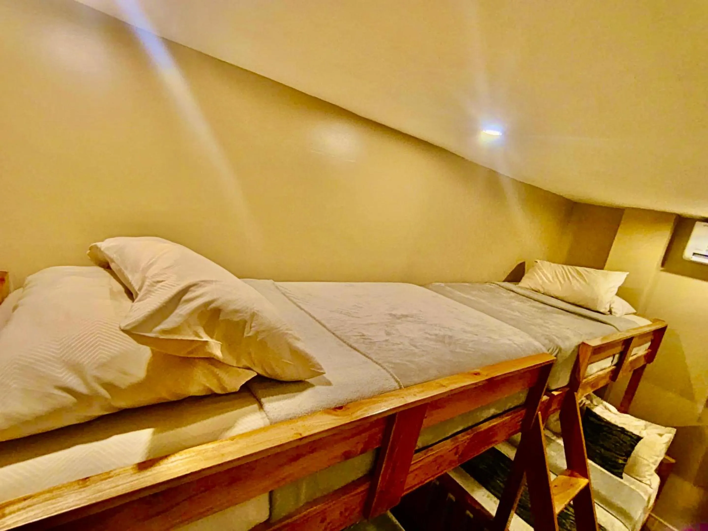 Bed in Southseas Beach Resort and Dive Center