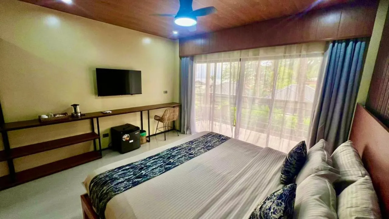 Bed in Southseas Beach Resort and Dive Center