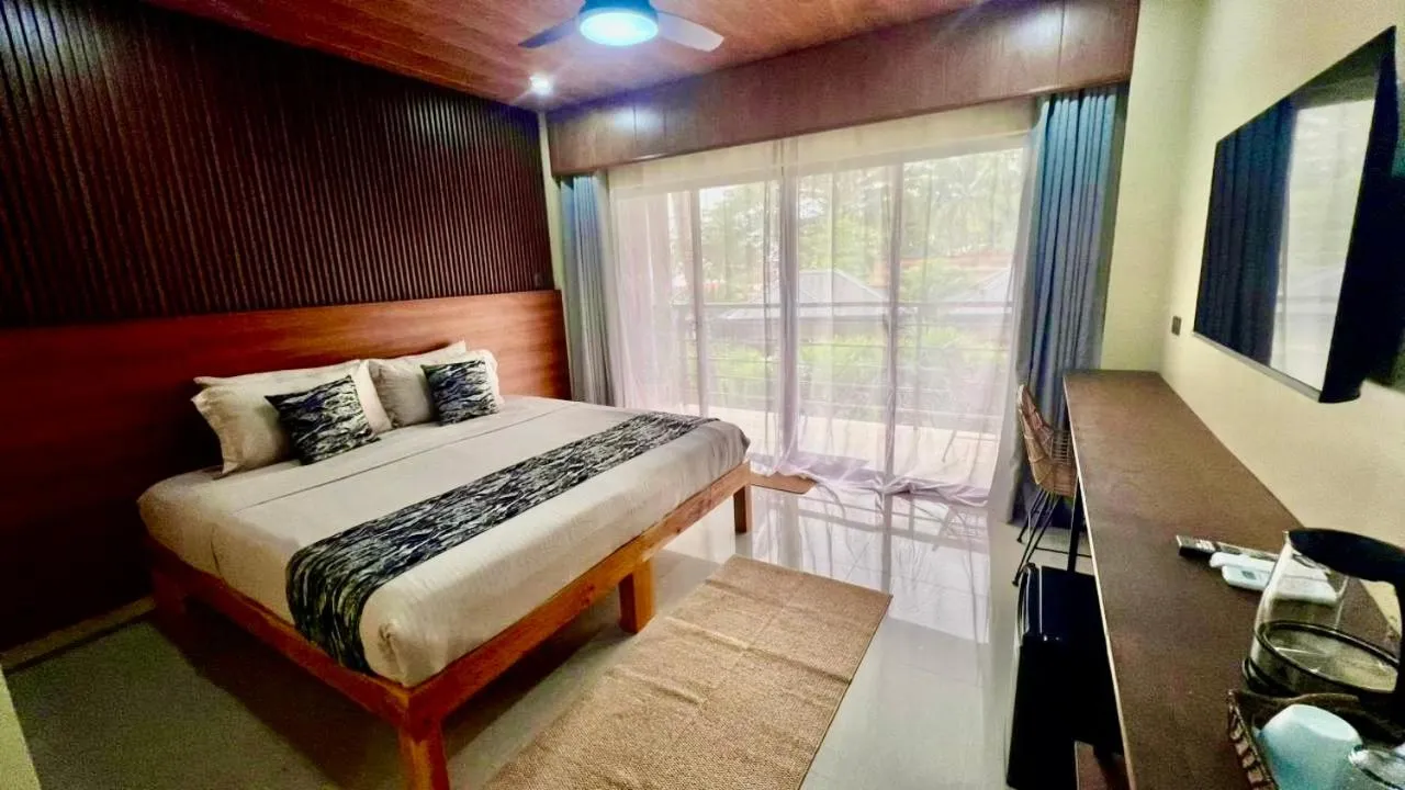 Bed in Southseas Beach Resort and Dive Center