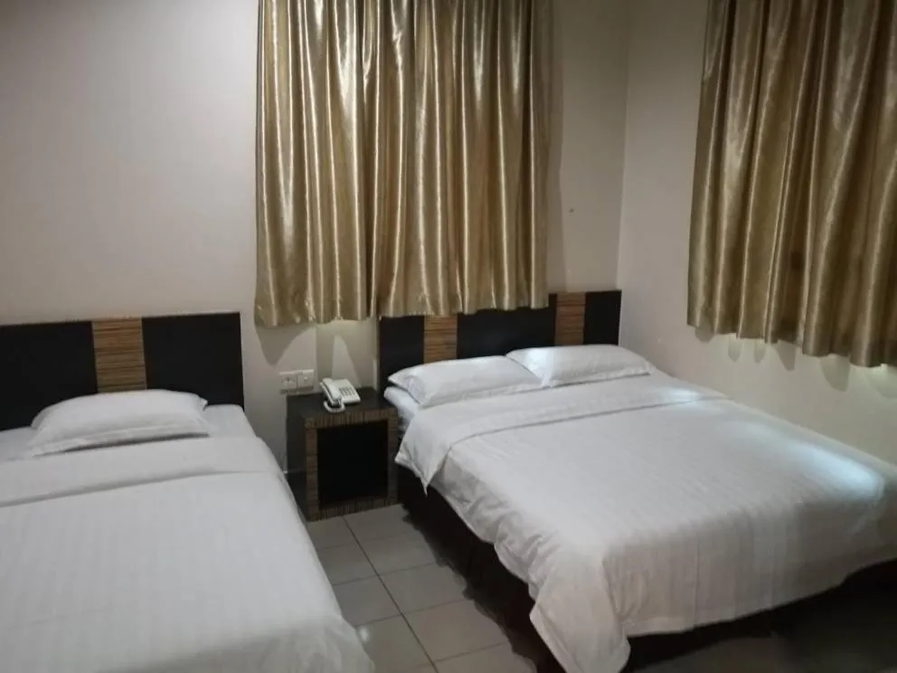 Bed in Hotel Traveller