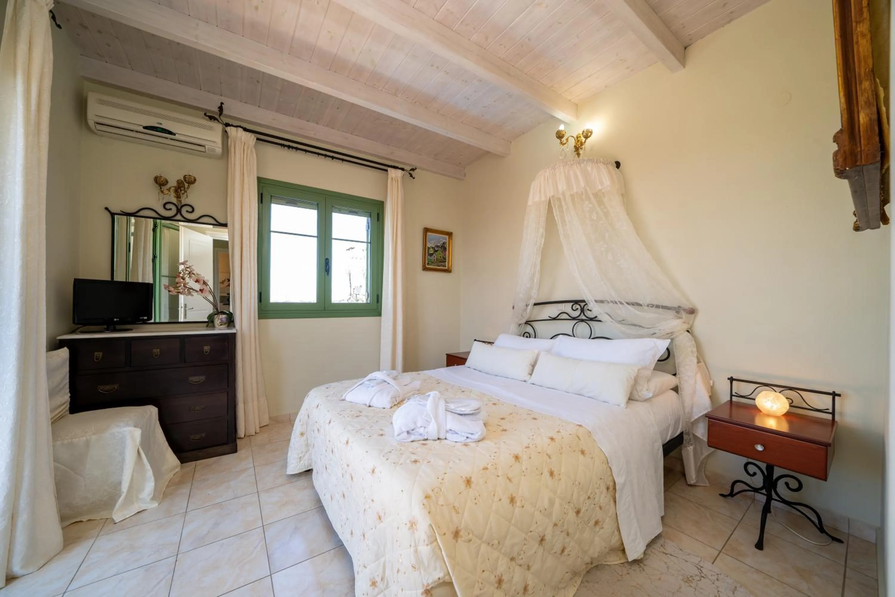 Bed in Monambeles Villas