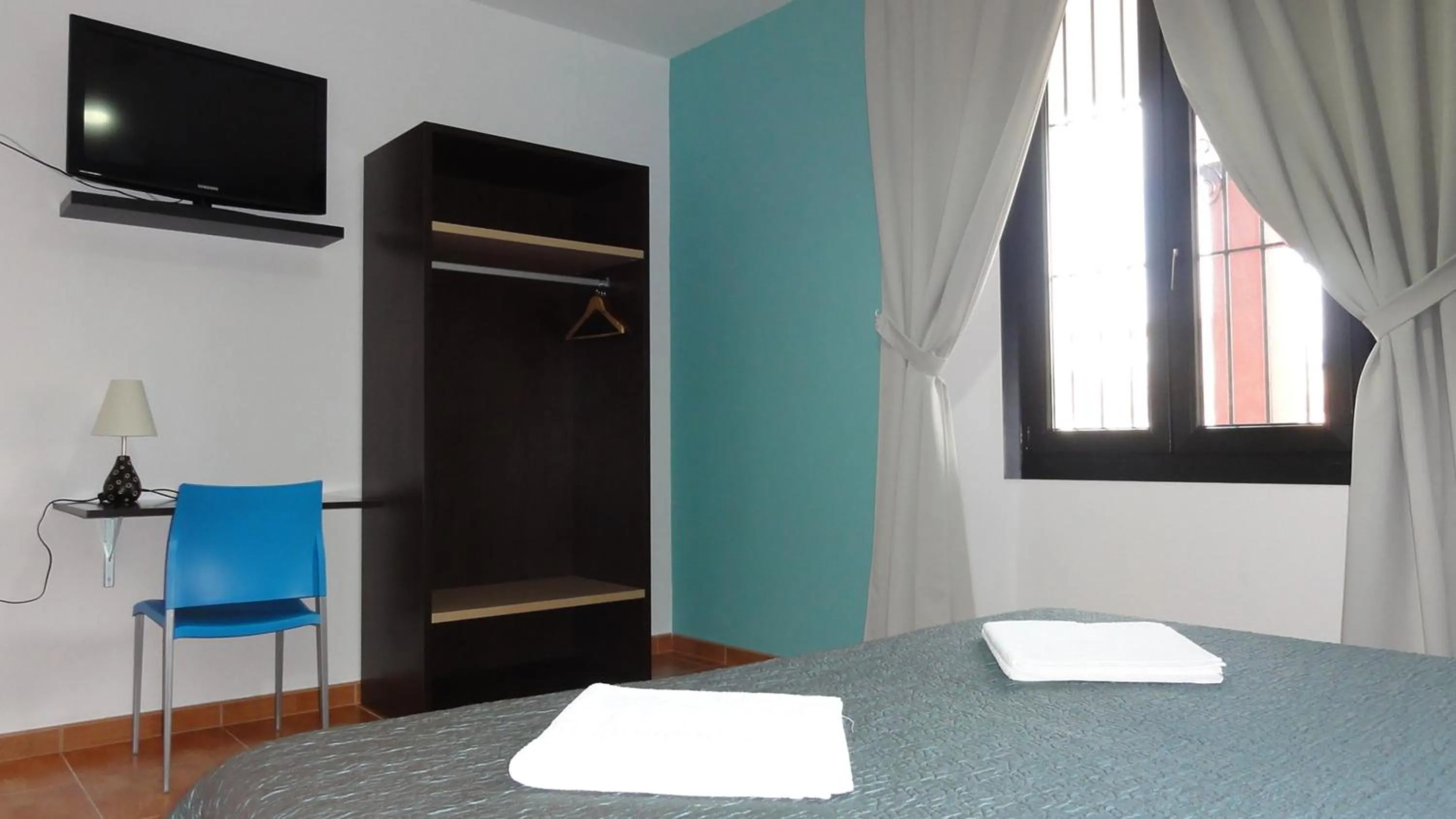 Seating area, Bed in Aparthotel Can Gallart