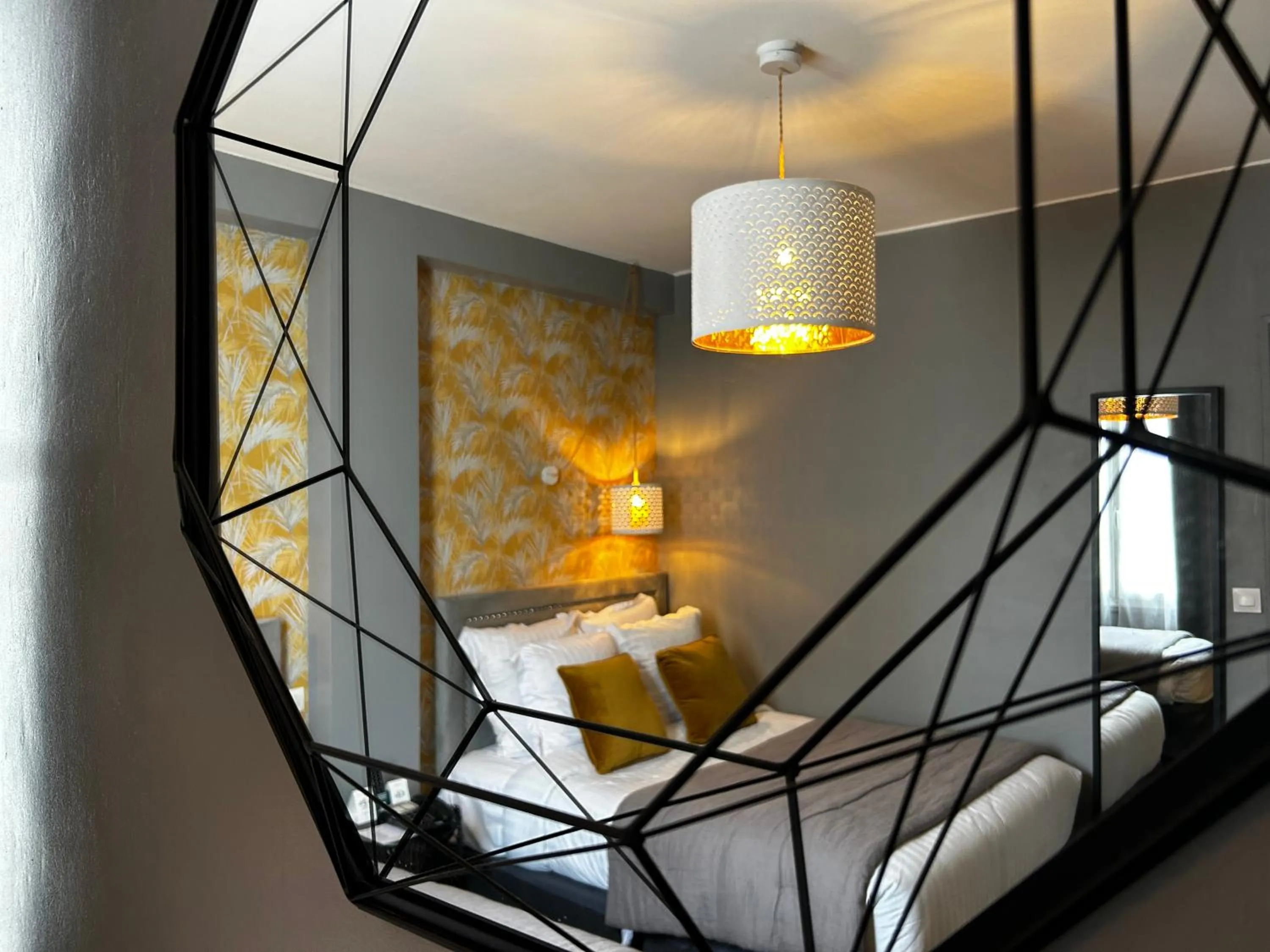 Decorative detail, Bed in Le Boeuf Couronné - Hôtel & Restaurant Chartres- Logis Hotels