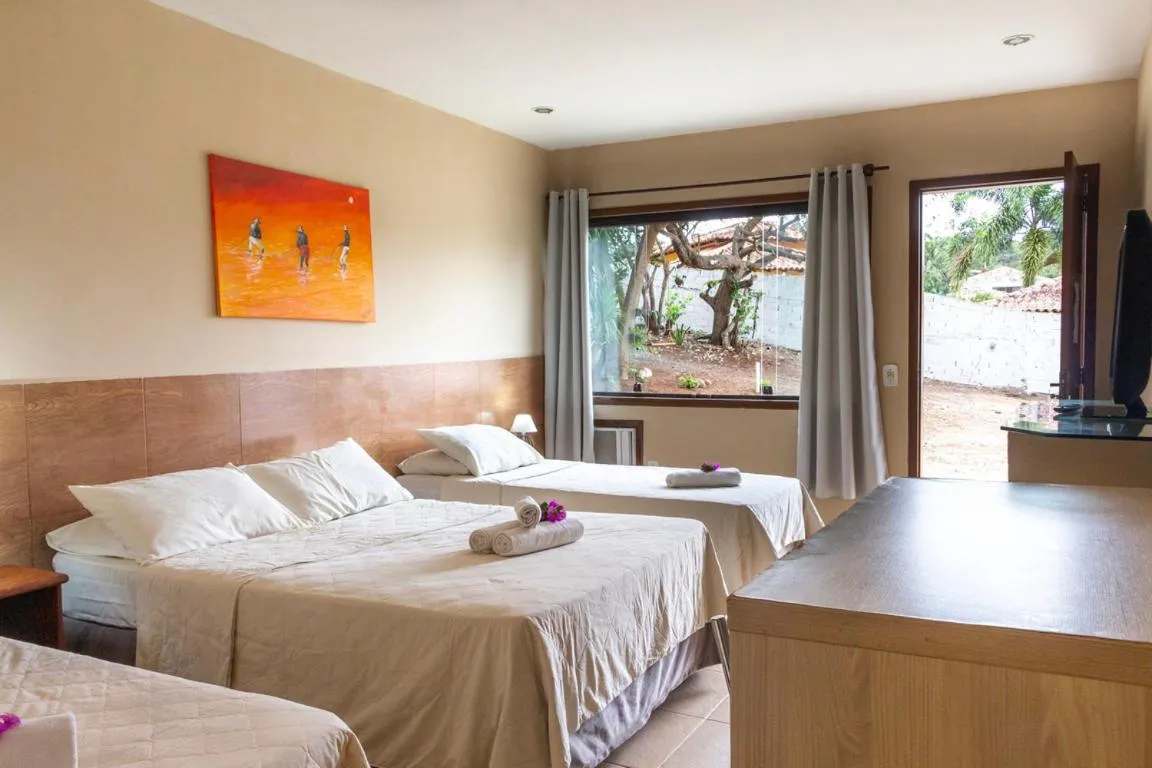 Bed in Pousada New Paradise